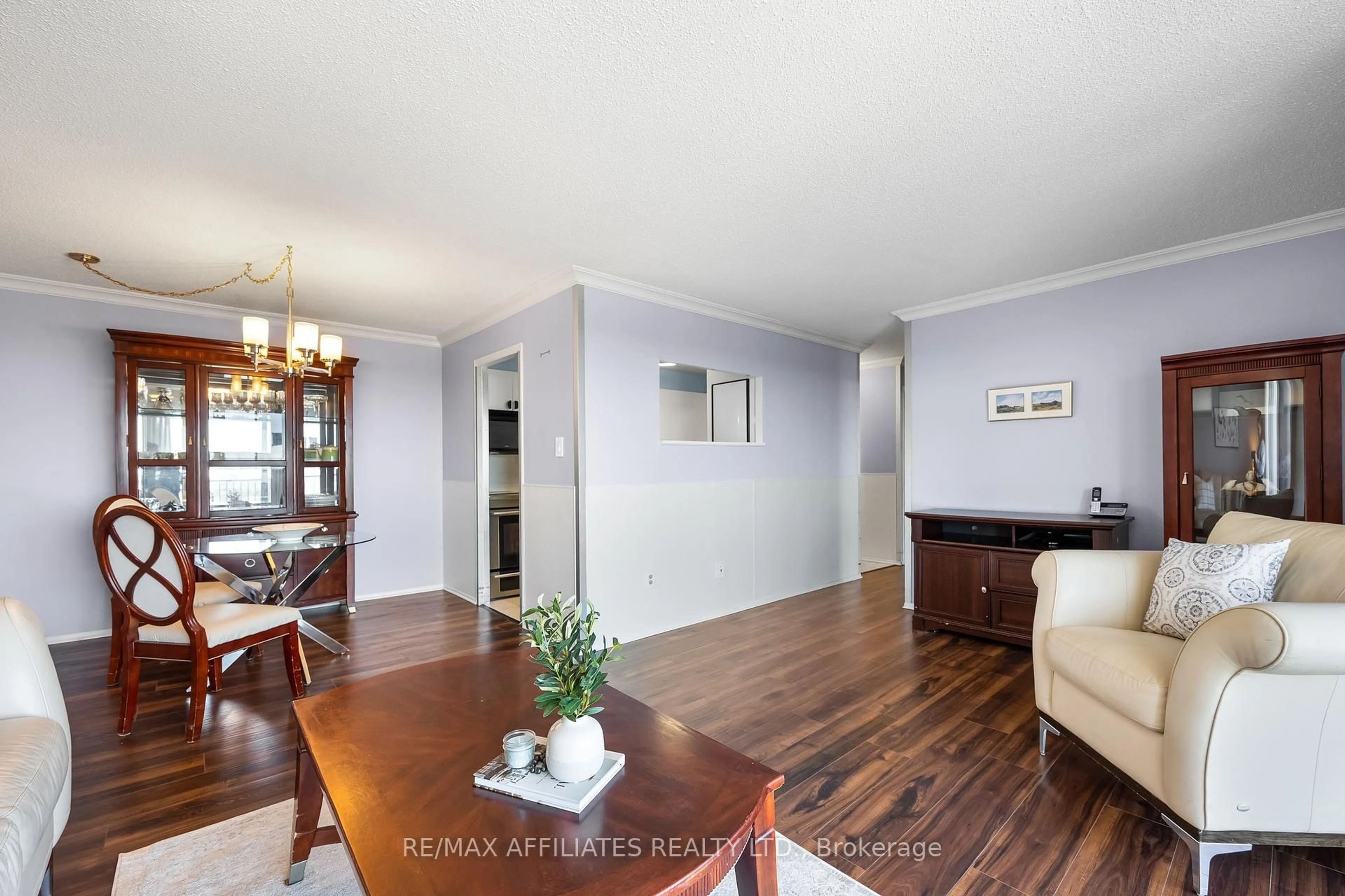 Living room with furniture, wood/laminate floor for 1025 RICHMOND RD  #2305 Rd, Ottawa Ontario K2B 8G8