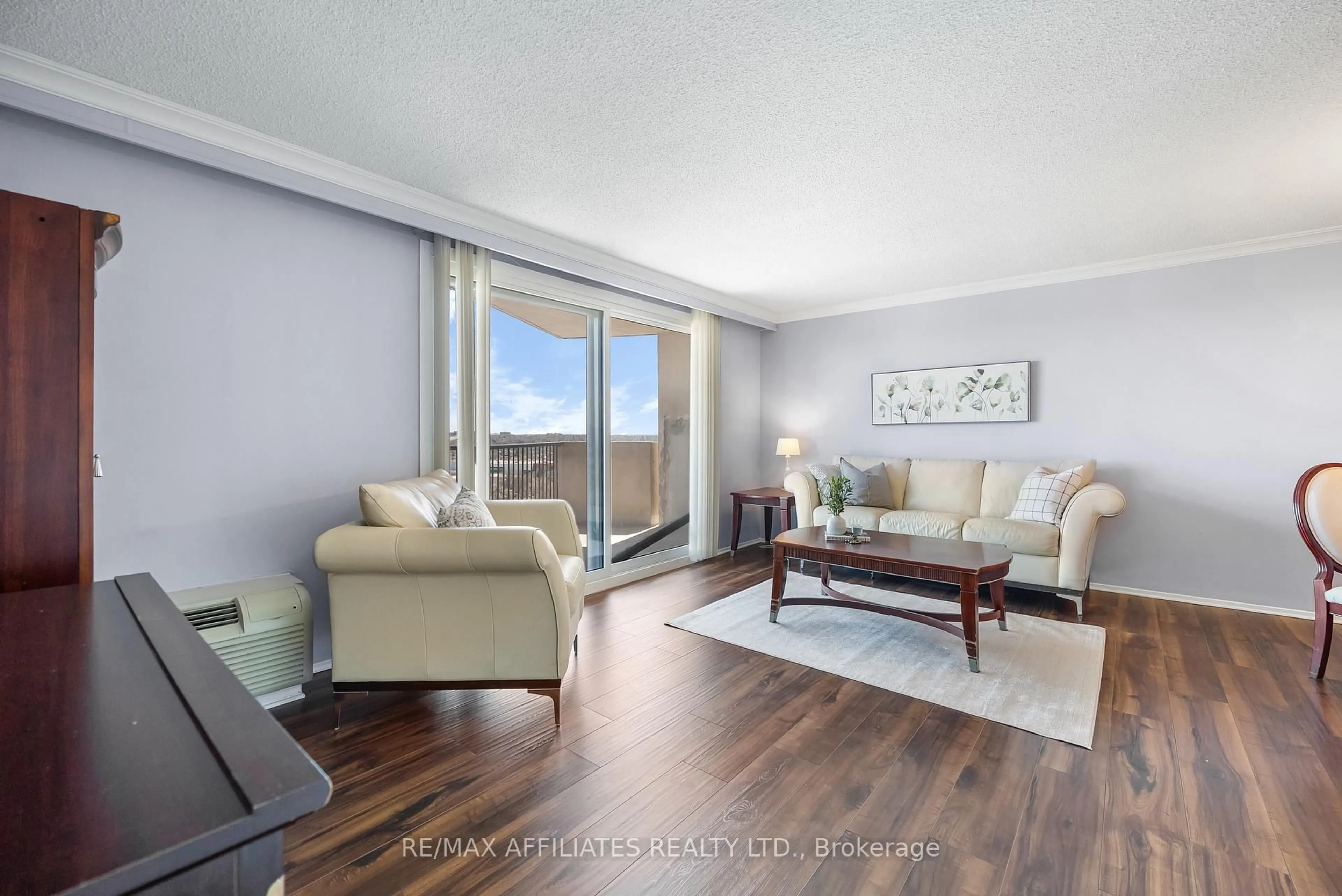 Living room with furniture, wood/laminate floor for 1025 RICHMOND RD  #2305 Rd, Ottawa Ontario K2B 8G8