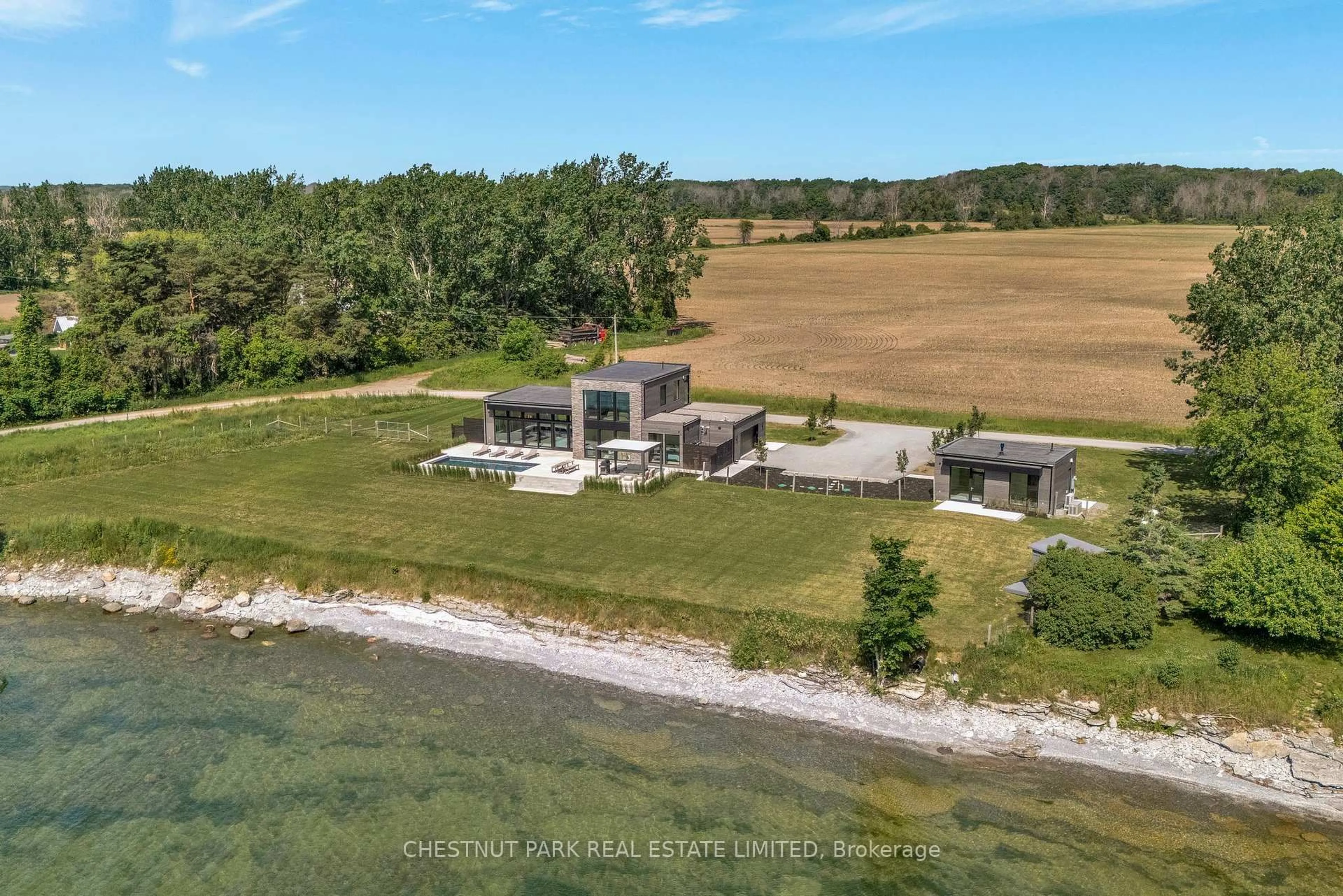 A pic from outside/outdoor area/front of a property/back of a property/a pic from drone, water/lake/river/ocean view for 34 Jarvis Lane, Prince Edward County Ontario K0K 2T0