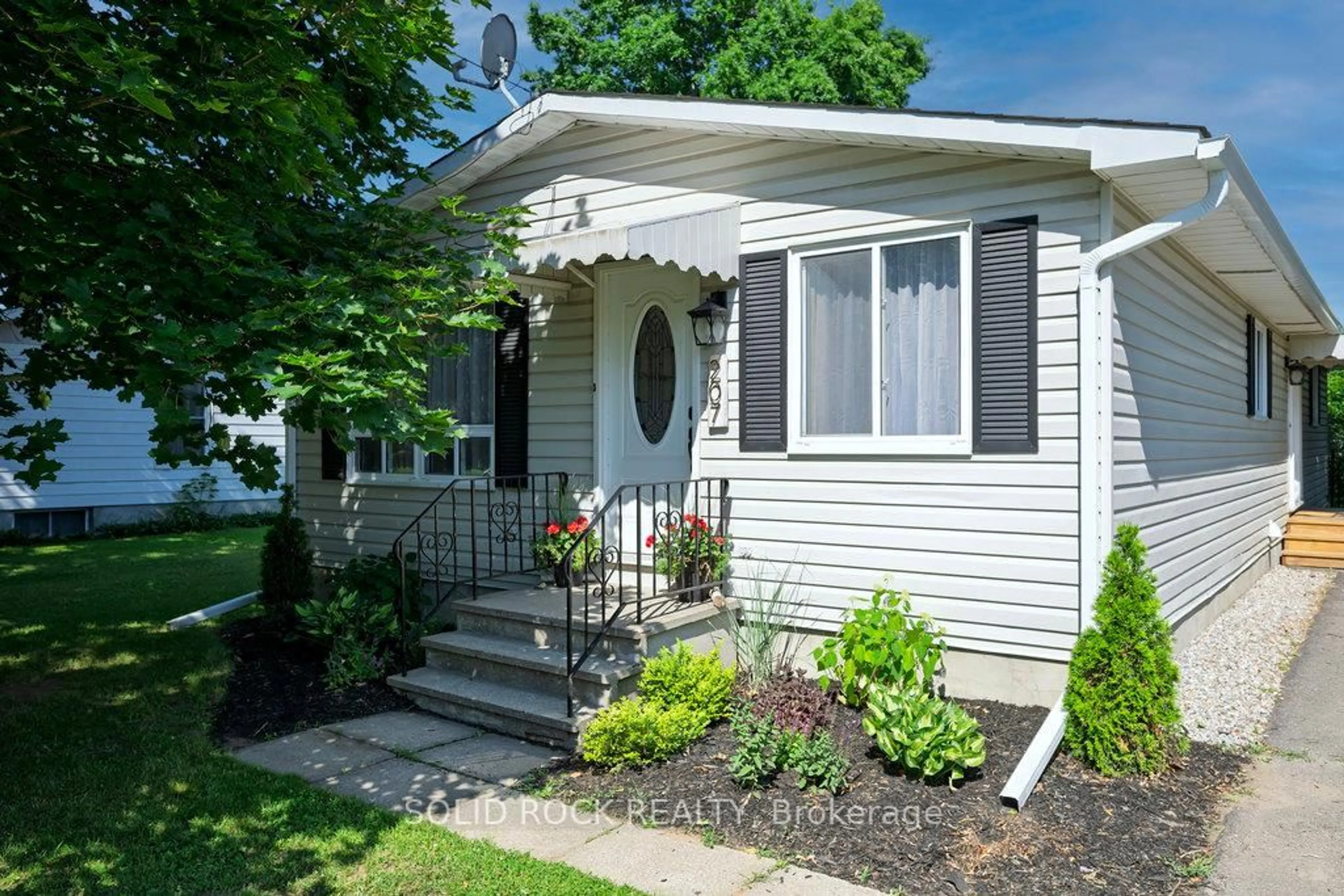 Home with vinyl exterior material, street for 207 George St, North Grenville Ontario K0G 1J0
