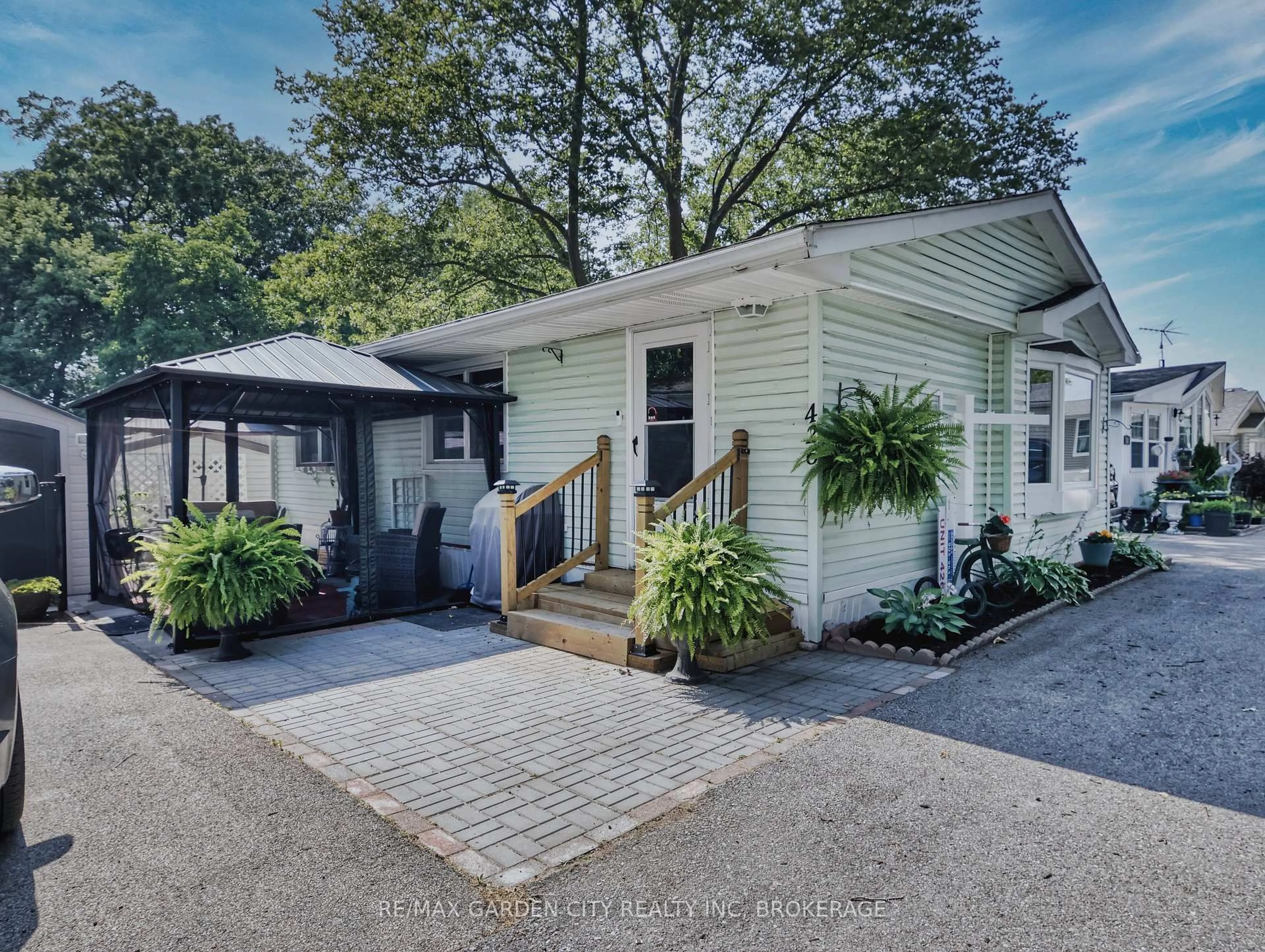 Home with vinyl exterior material, street for 23 Four Mile Creek Rd #426, Niagara-on-the-Lake Ontario L0S 1J1