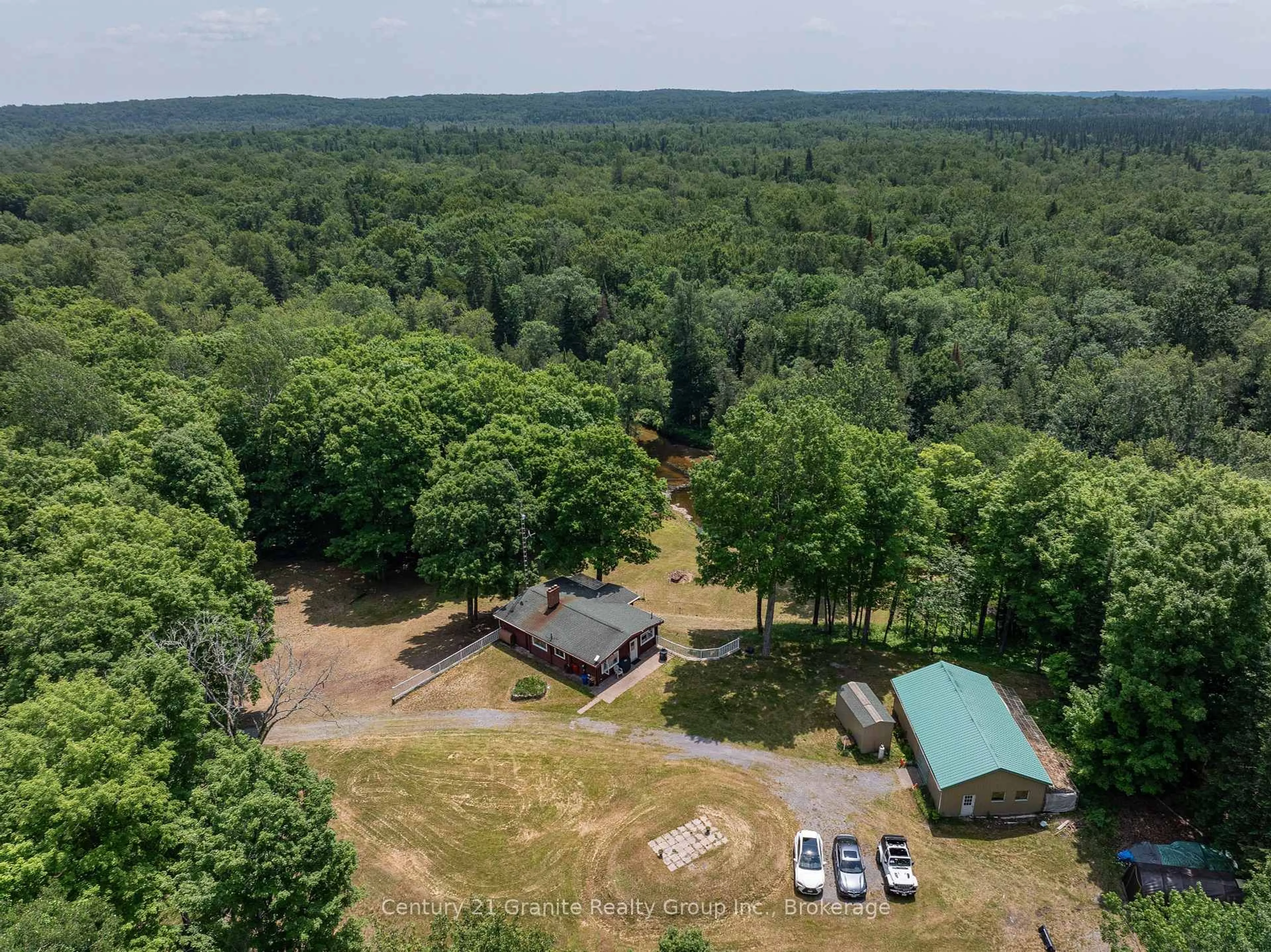 A pic from outside/outdoor area/front of a property/back of a property/a pic from drone, forest/trees view for 329 Rose Island Rd, North Kawartha Ontario K0L 1A0