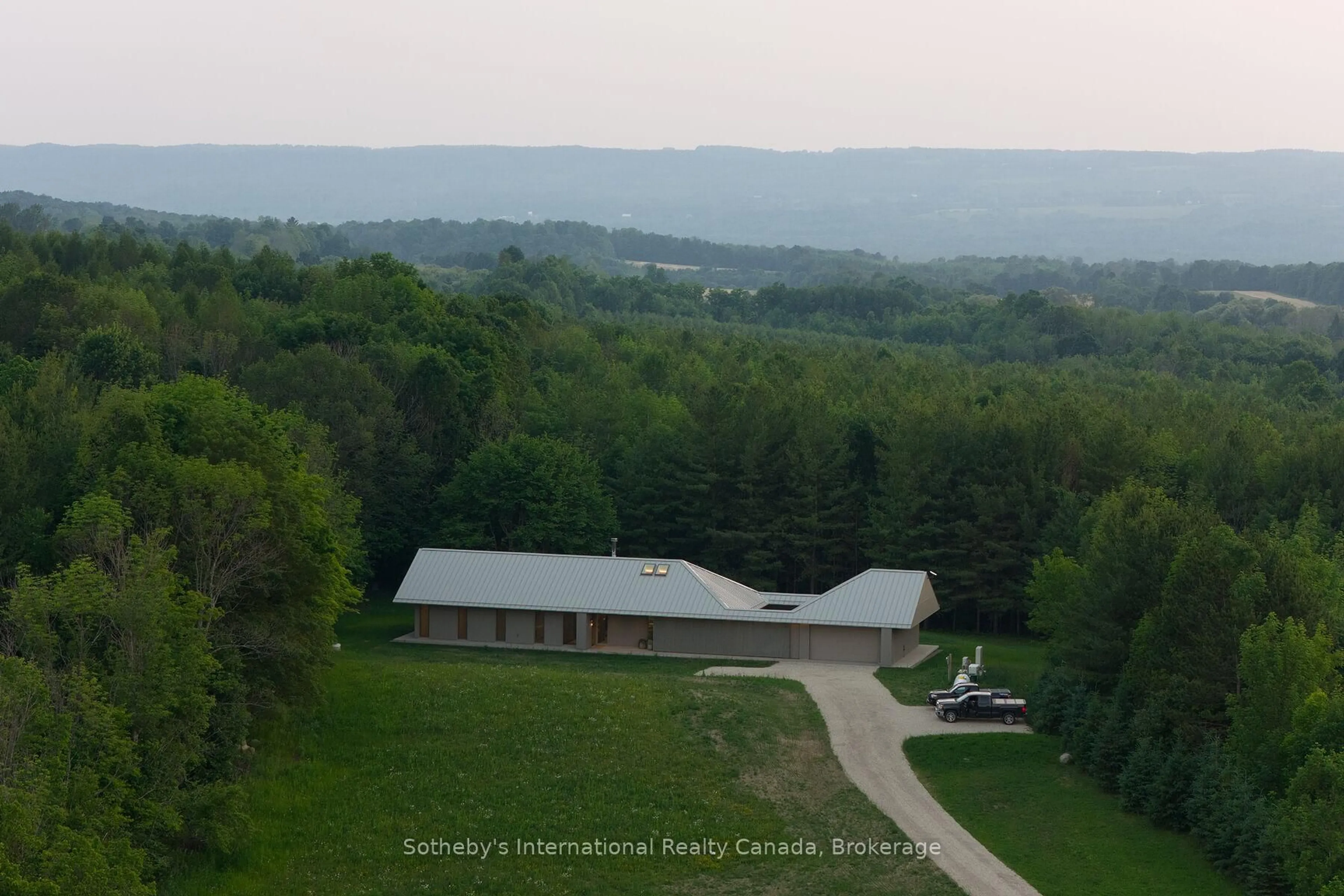 A pic from outside/outdoor area/front of a property/back of a property/a pic from drone, mountain view for 395910 11TH Line, Blue Mountains Ontario N0H 1J0