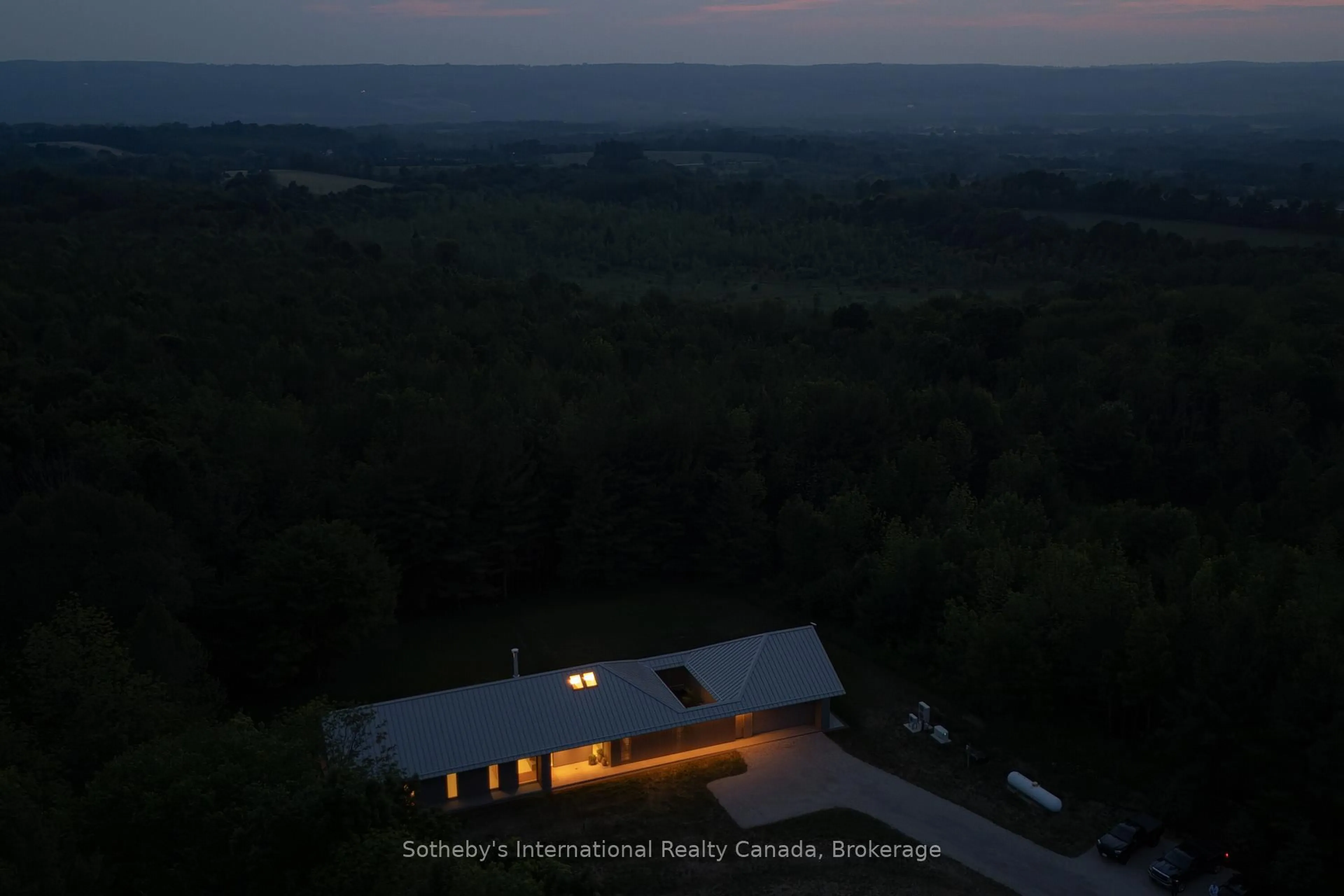 A pic from outside/outdoor area/front of a property/back of a property/a pic from drone, unknown for 395910 11TH Line, Blue Mountains Ontario N0H 1J0