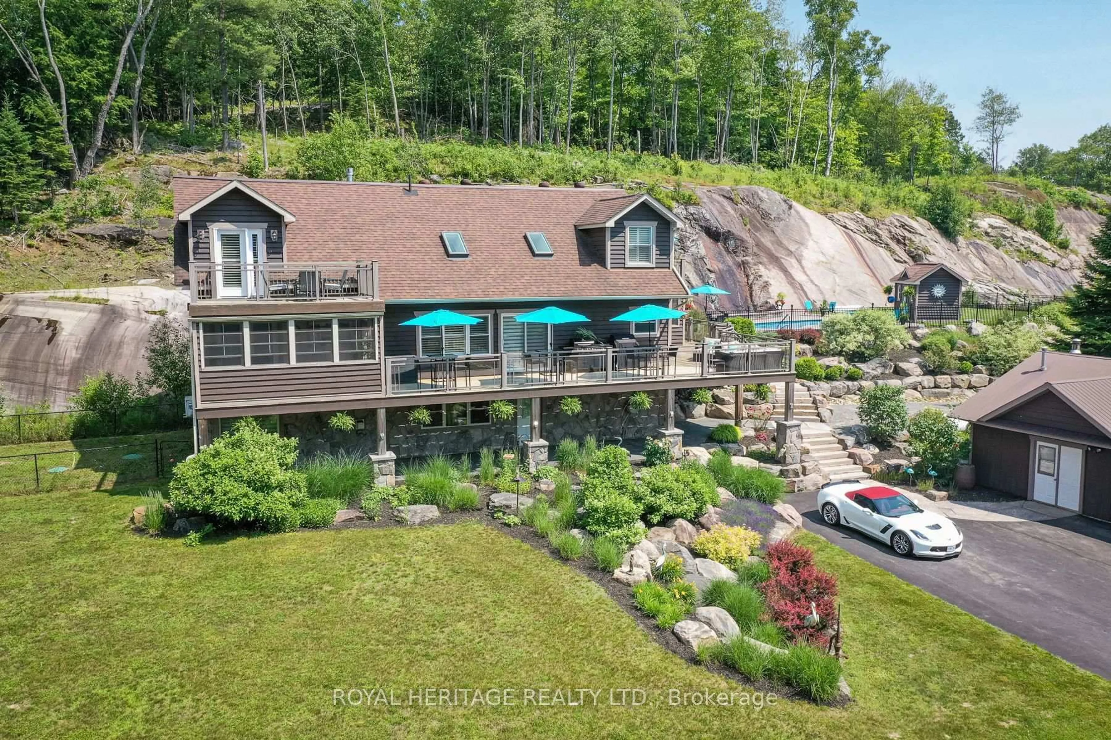 A pic from outside/outdoor area/front of a property/back of a property/a pic from drone, water/lake/river/ocean view for 120 Hutcheson Beach Rd, Huntsville Ontario P1H 1N4