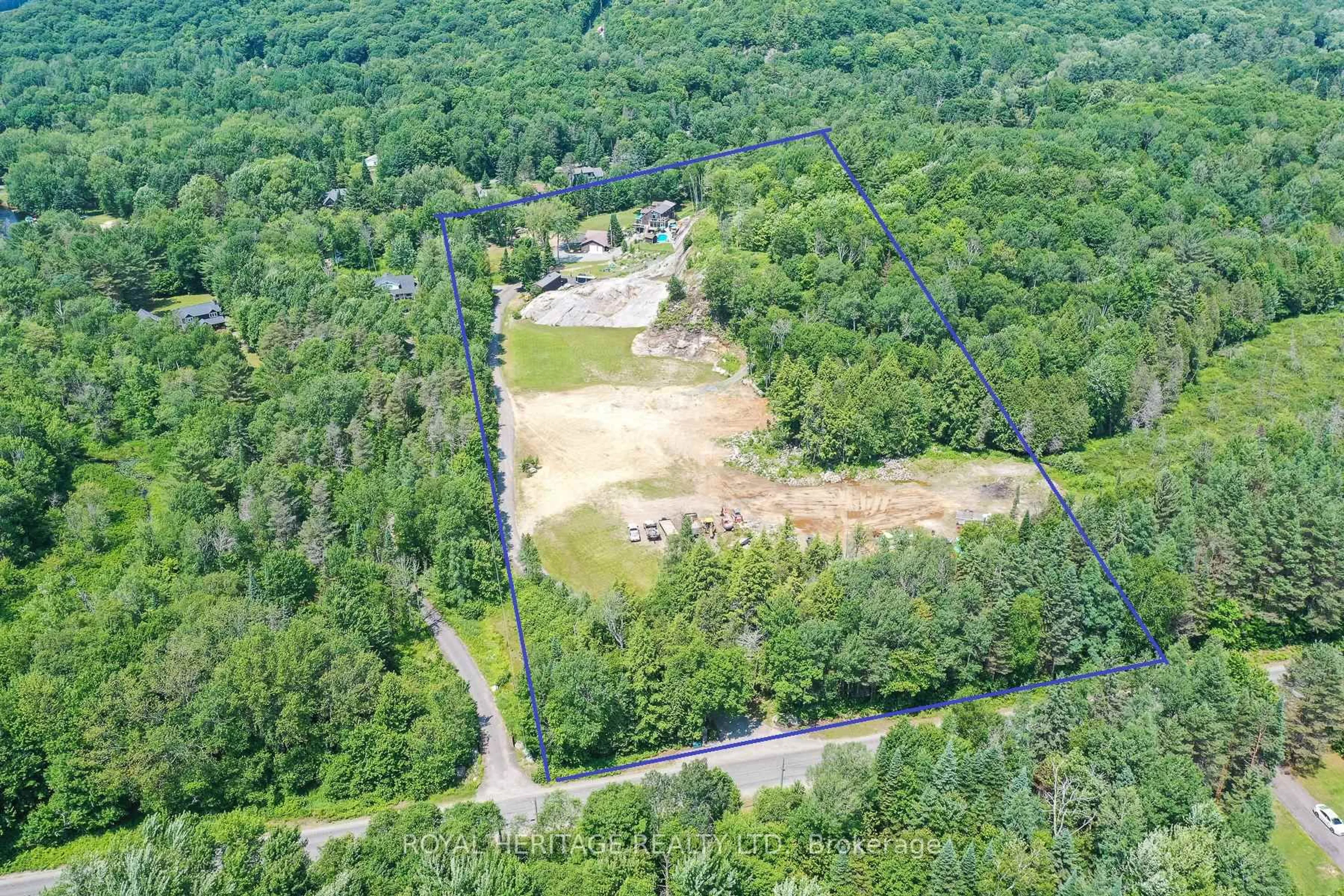 A pic from outside/outdoor area/front of a property/back of a property/a pic from drone, forest/trees view for 120 Hutcheson Beach Rd, Huntsville Ontario P1H 1N4