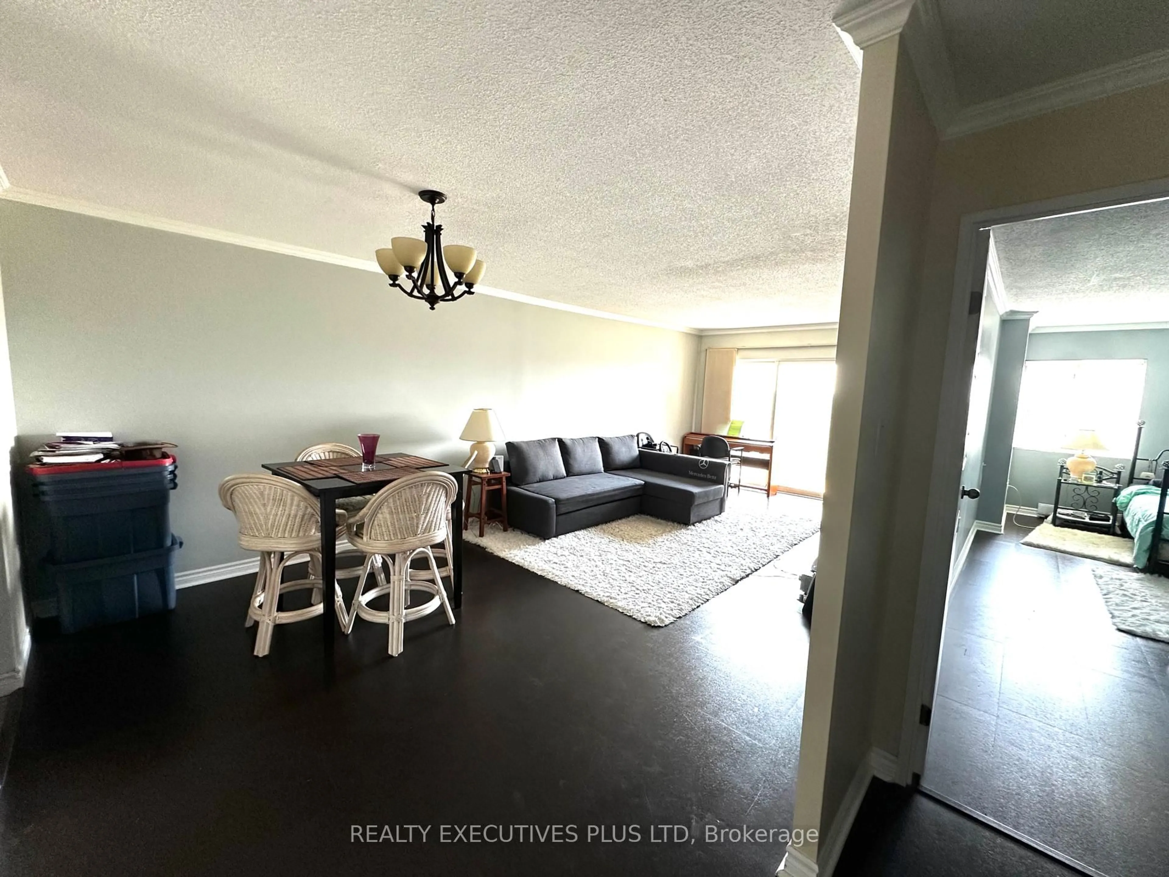 Living room with furniture, wood/laminate floor for 858 Commissioners Rd #806, London South Ontario N6C 5Y5