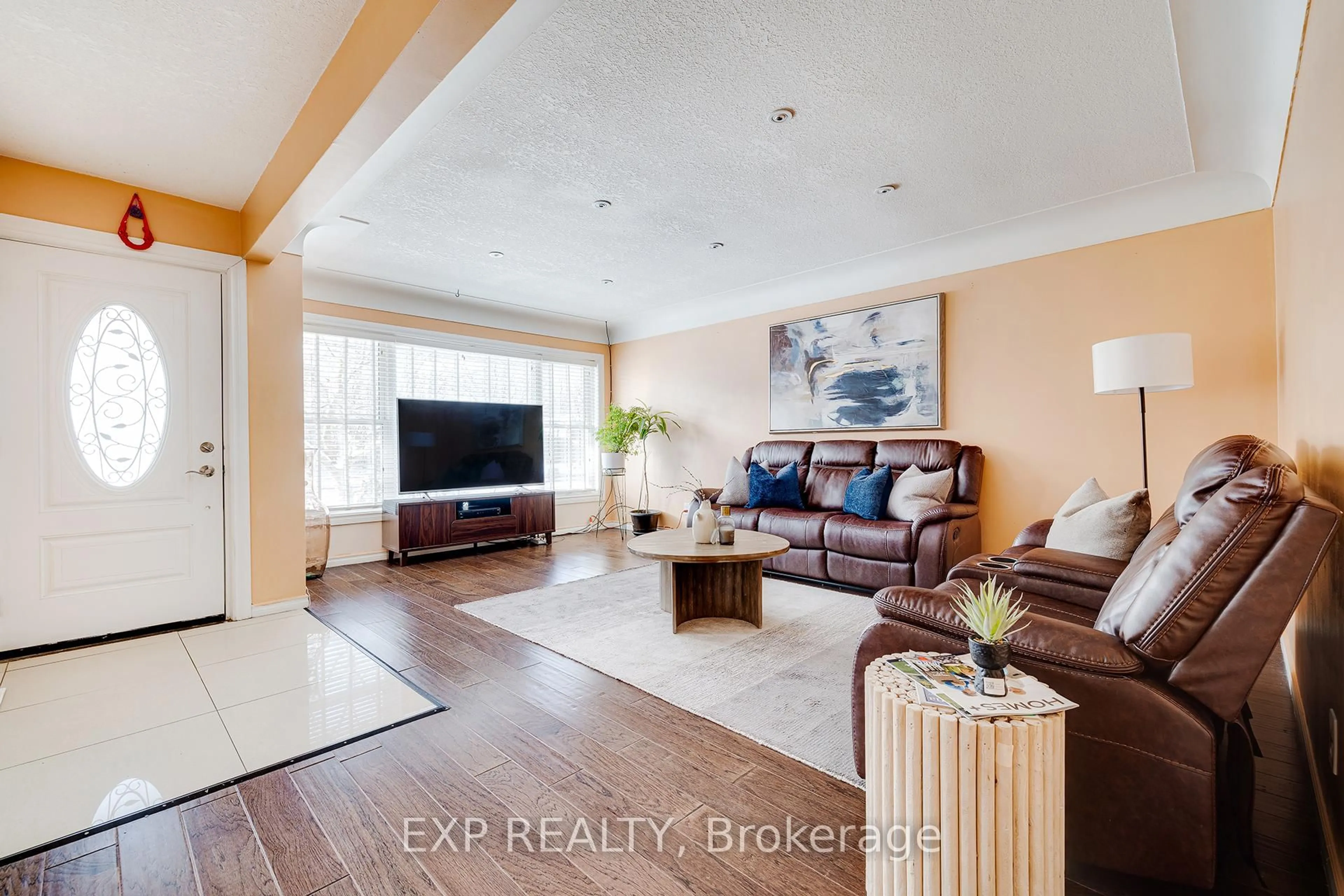 Living room with furniture, wood/laminate floor for 392 Fischer Hallman Rd, Kitchener Ontario N2M 4Y1