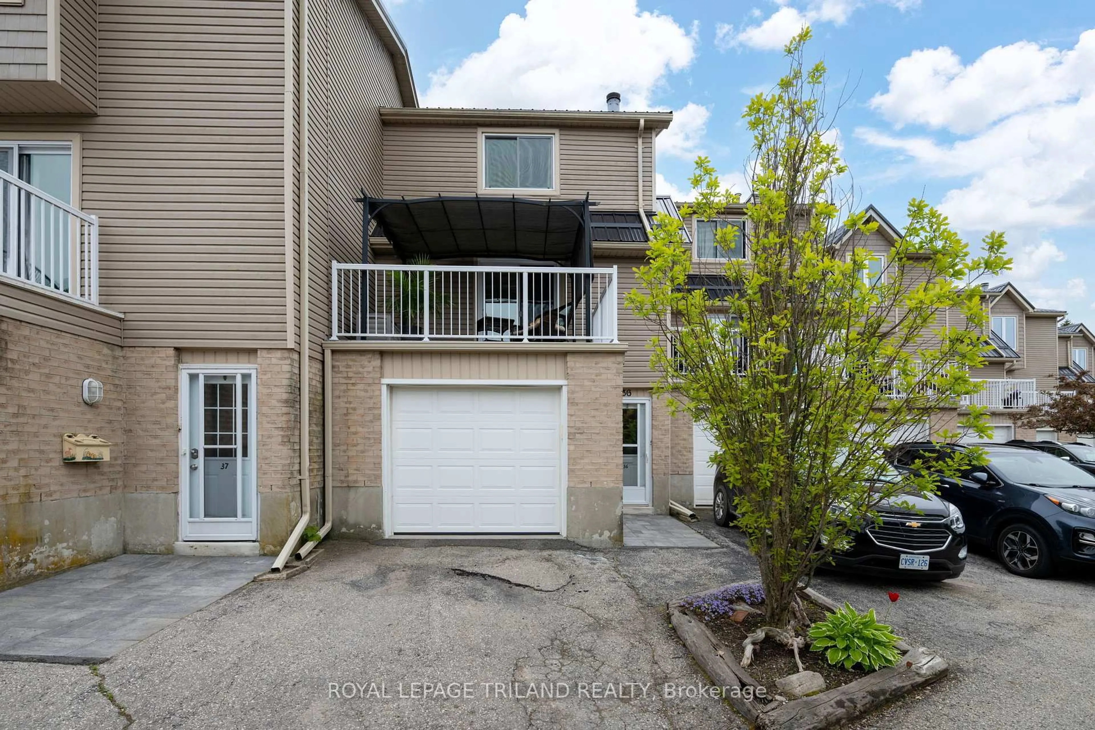 A pic from outside/outdoor area/front of a property/back of a property/a pic from drone, street for 301 Carlow Rd #36, Central Elgin Ontario N5L 1B8