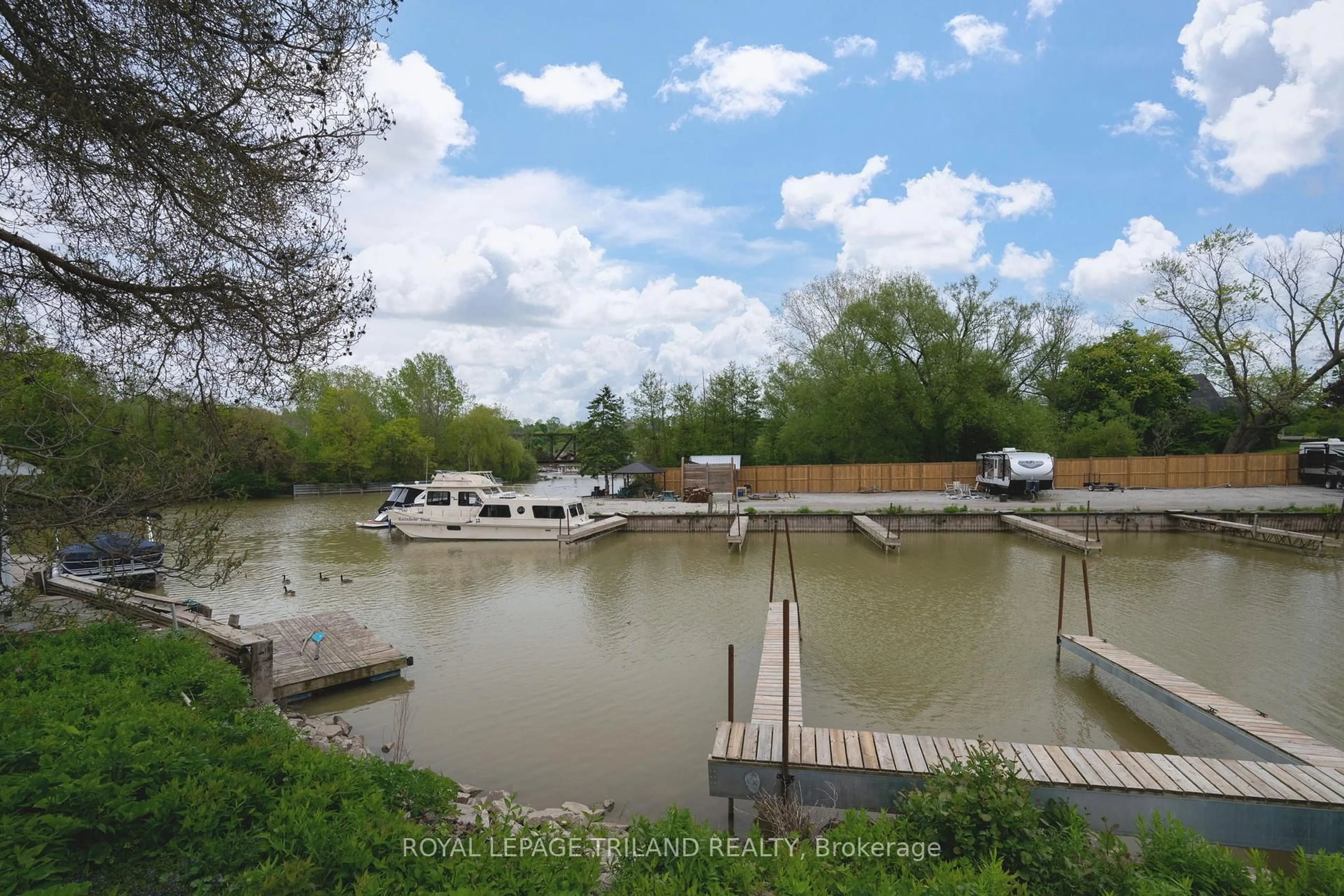 A pic from outside/outdoor area/front of a property/back of a property/a pic from drone, water/lake/river/ocean view for 301 Carlow Rd #36, Central Elgin Ontario N5L 1B8