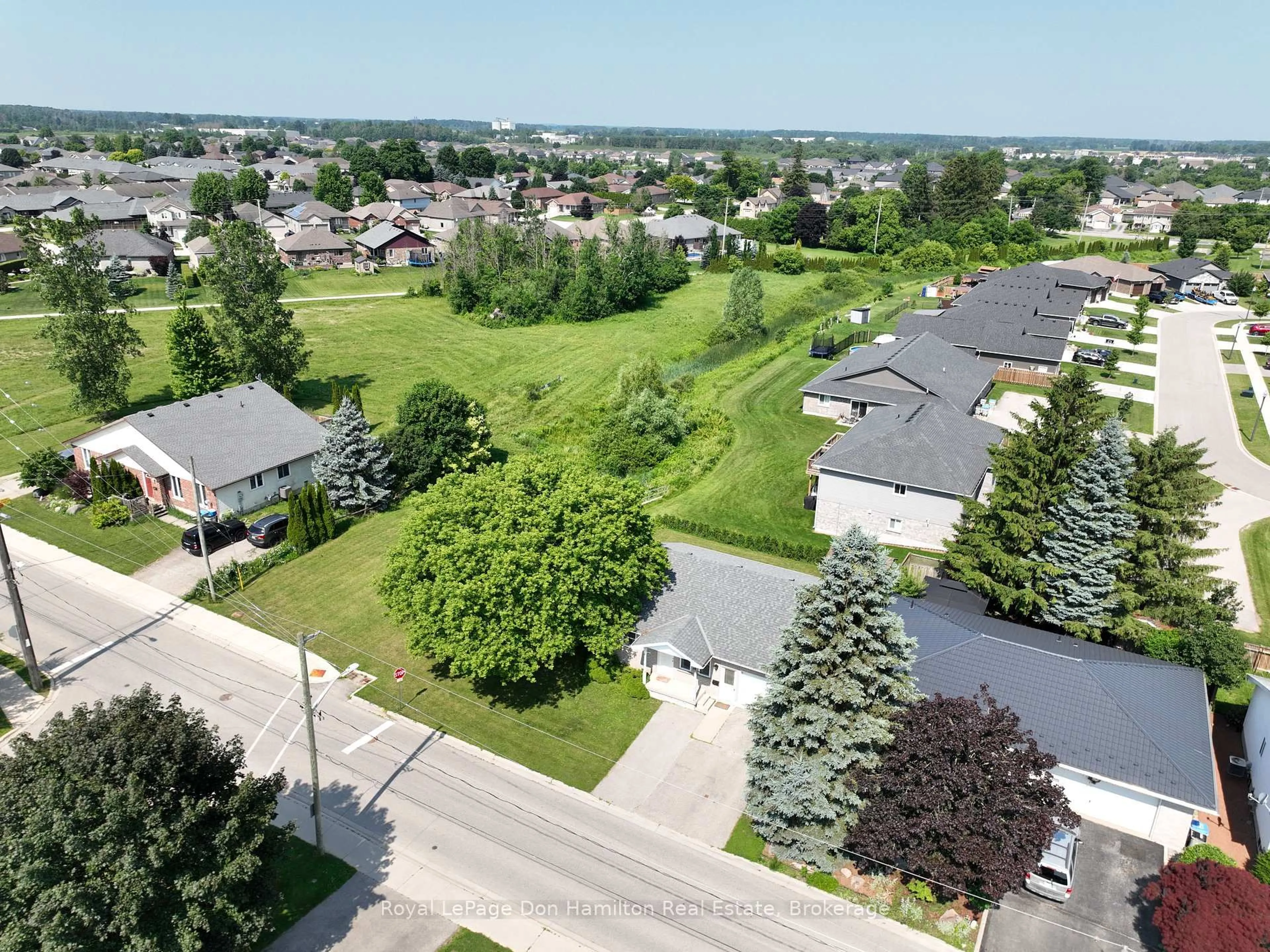 A pic from outside/outdoor area/front of a property/back of a property/a pic from drone, street for 695 Reserve Ave, North Perth Ontario N4W 2L3