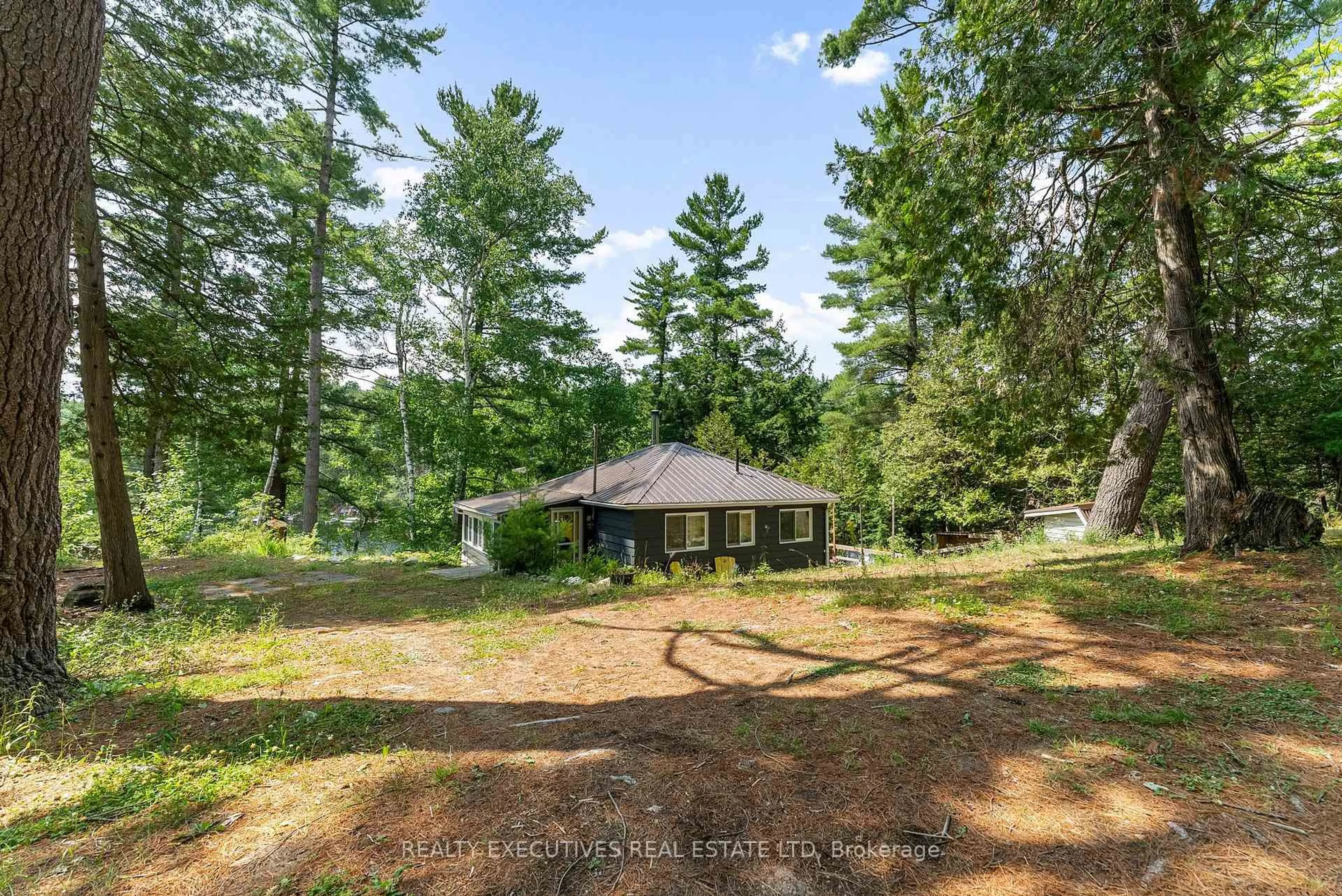 A pic from outside/outdoor area/front of a property/back of a property/a pic from drone, forest/trees view for 2046 Cyr Point Rd, Perth Ontario K7H 3C9