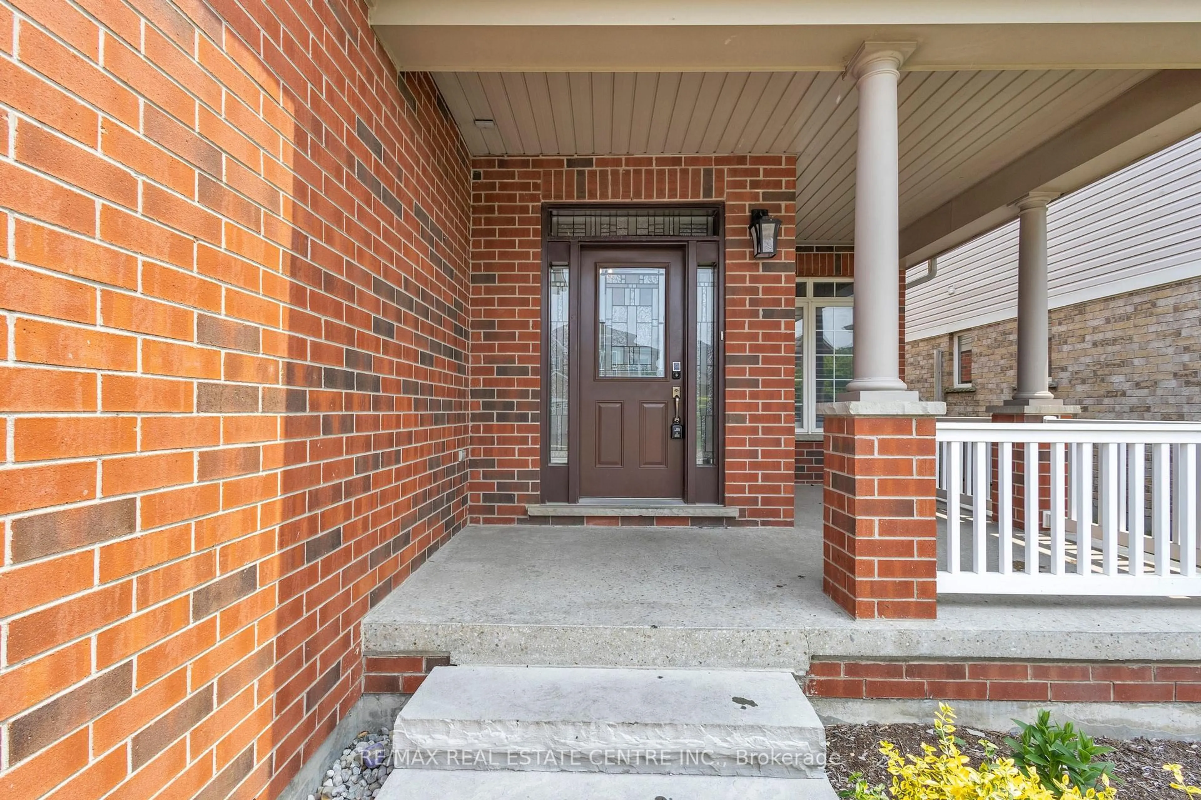 Home with brick exterior material, street for 319 Robert Ferrie Dr, Kitchener Ontario N2P 2Y7