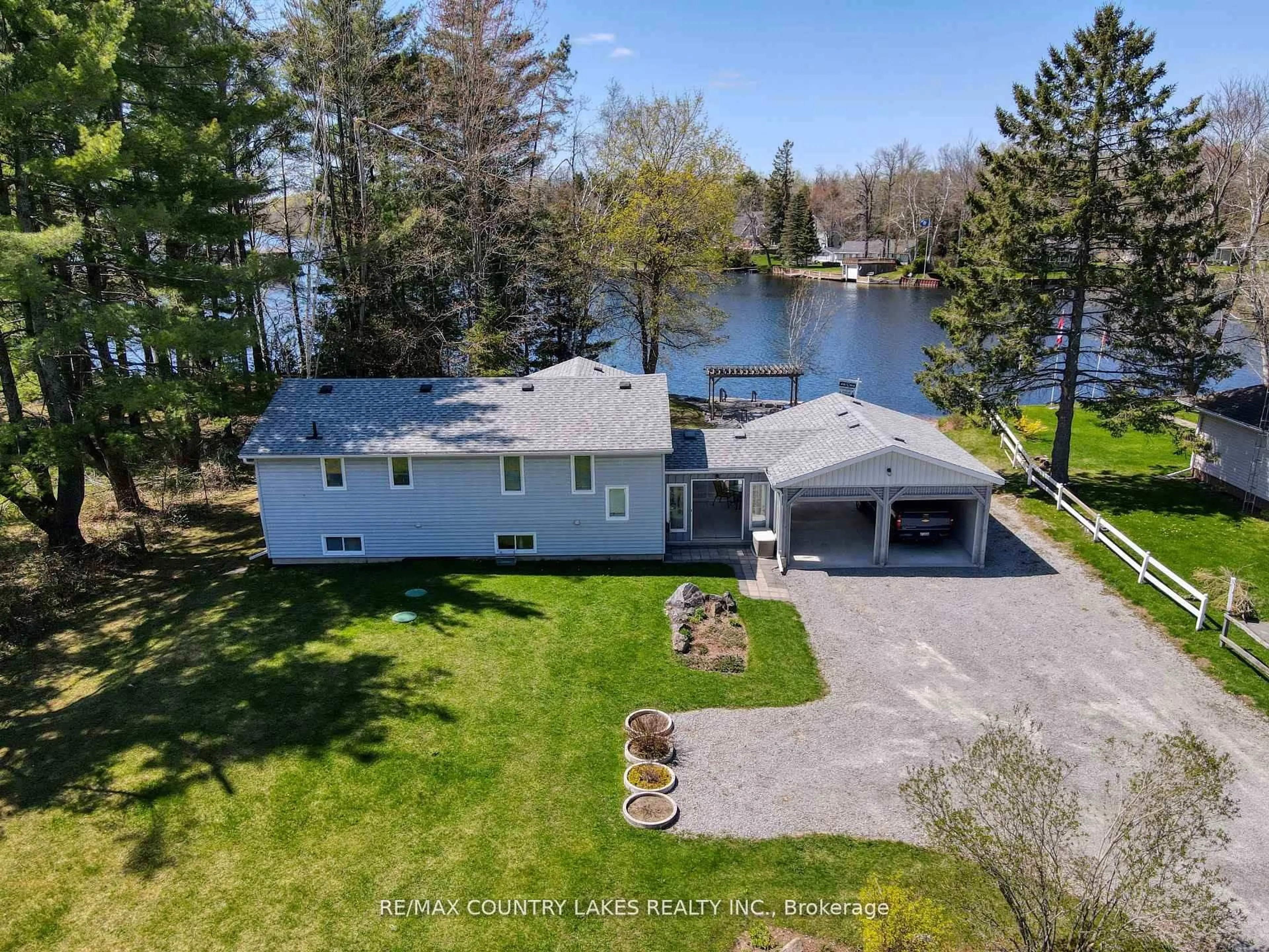 A pic from outside/outdoor area/front of a property/back of a property/a pic from drone, water/lake/river/ocean view for 31 Portage Rd, Kawartha Lakes Ontario K0M 2T0