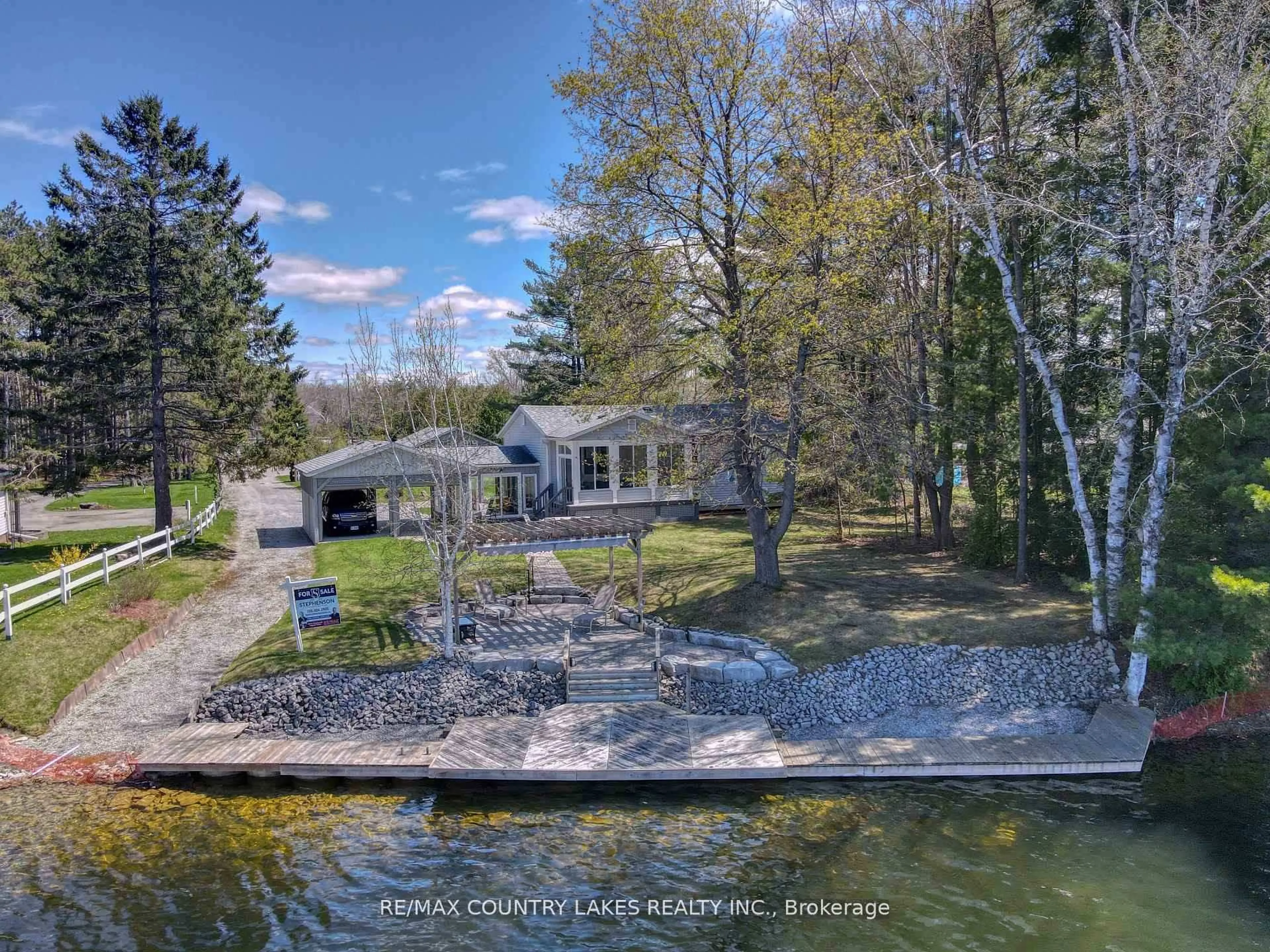 A pic from outside/outdoor area/front of a property/back of a property/a pic from drone, water/lake/river/ocean view for 31 Portage Rd, Kawartha Lakes Ontario K0M 2T0