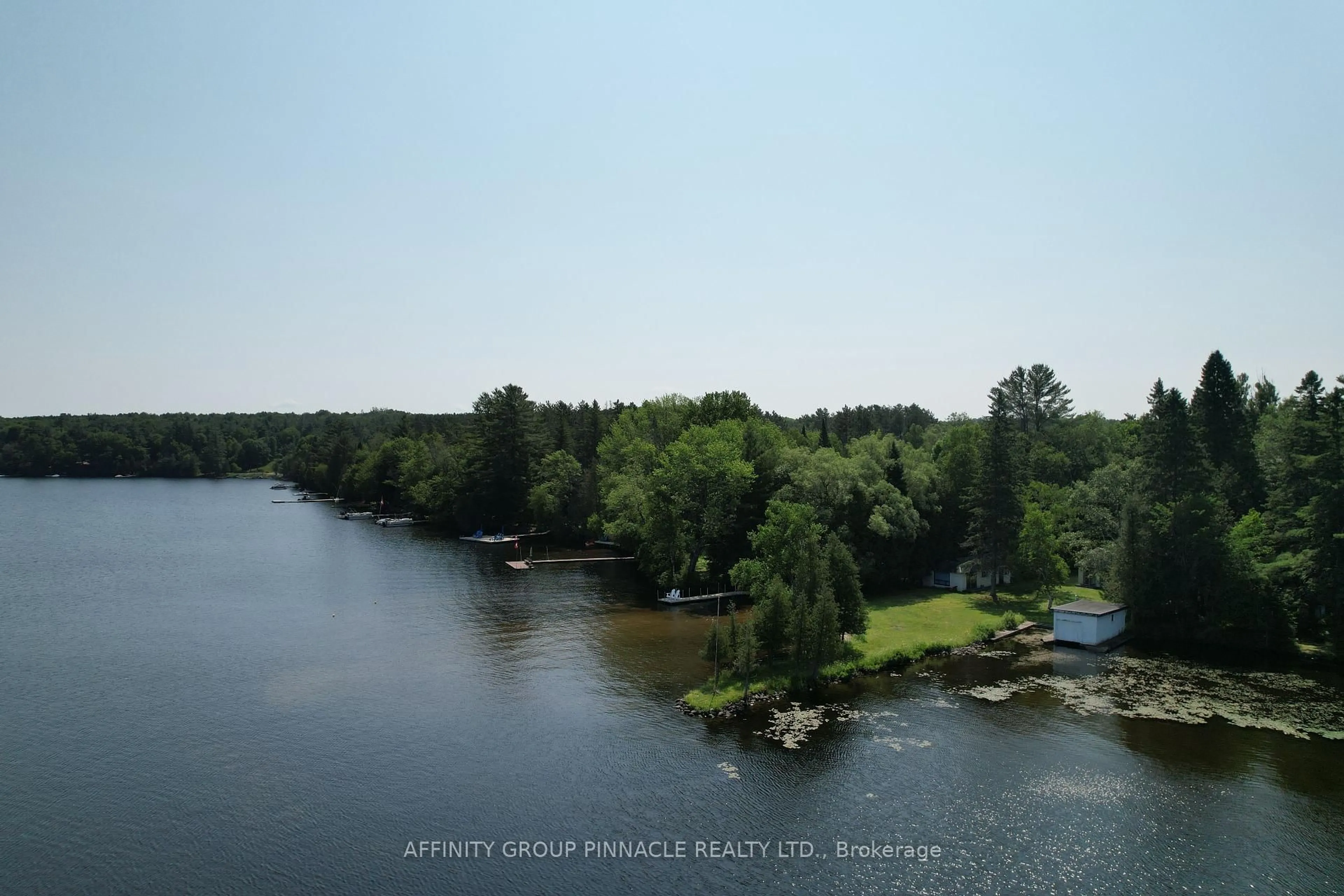 A pic from outside/outdoor area/front of a property/back of a property/a pic from drone, water/lake/river/ocean view for 1265 Kashagawigamog Lake Rd, Minden Hills Ontario K0M 2K0