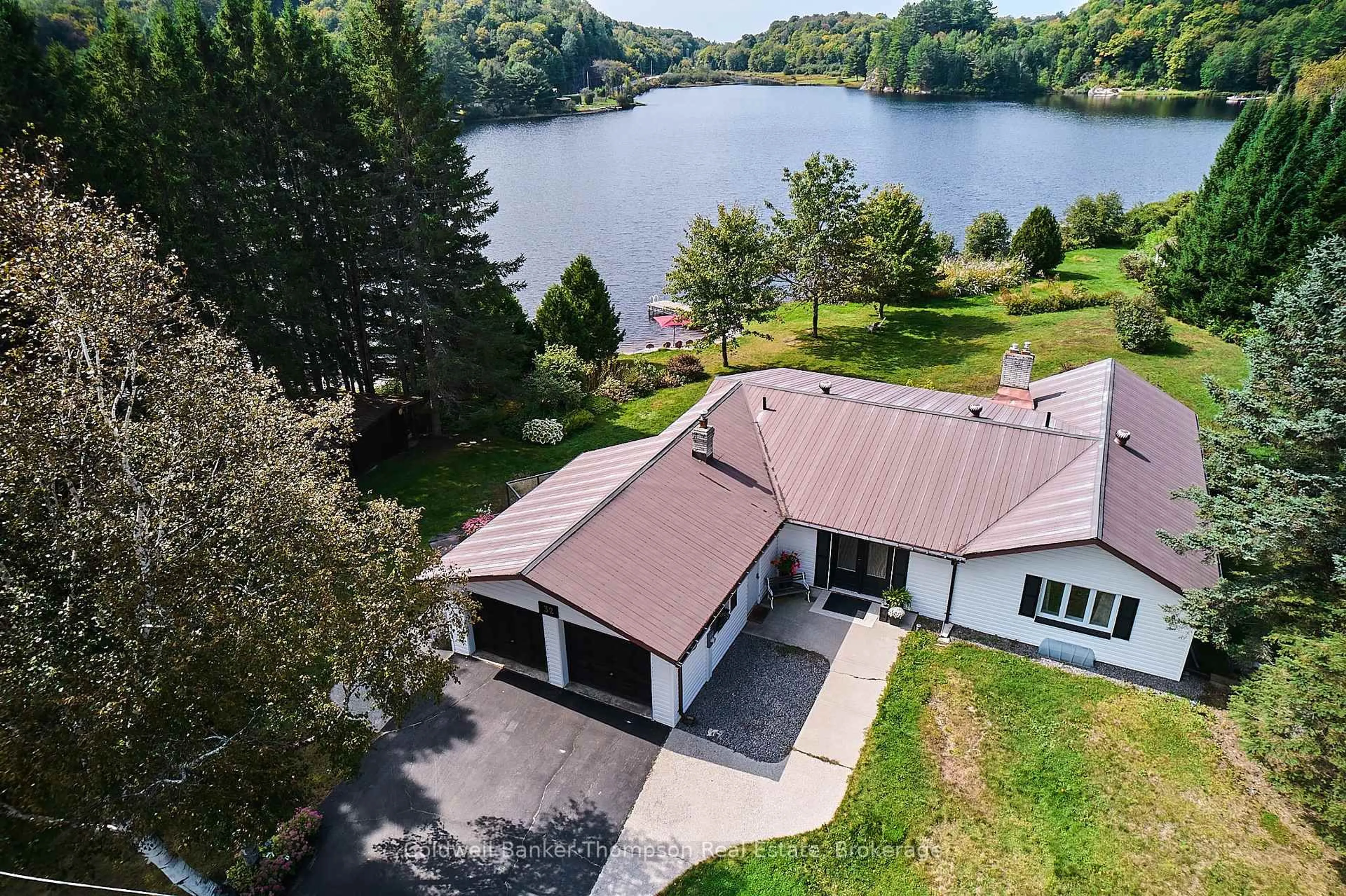 A pic from outside/outdoor area/front of a property/back of a property/a pic from drone, water/lake/river/ocean view for 32 Beach Rd, Huntsville Ontario P0B 1M0