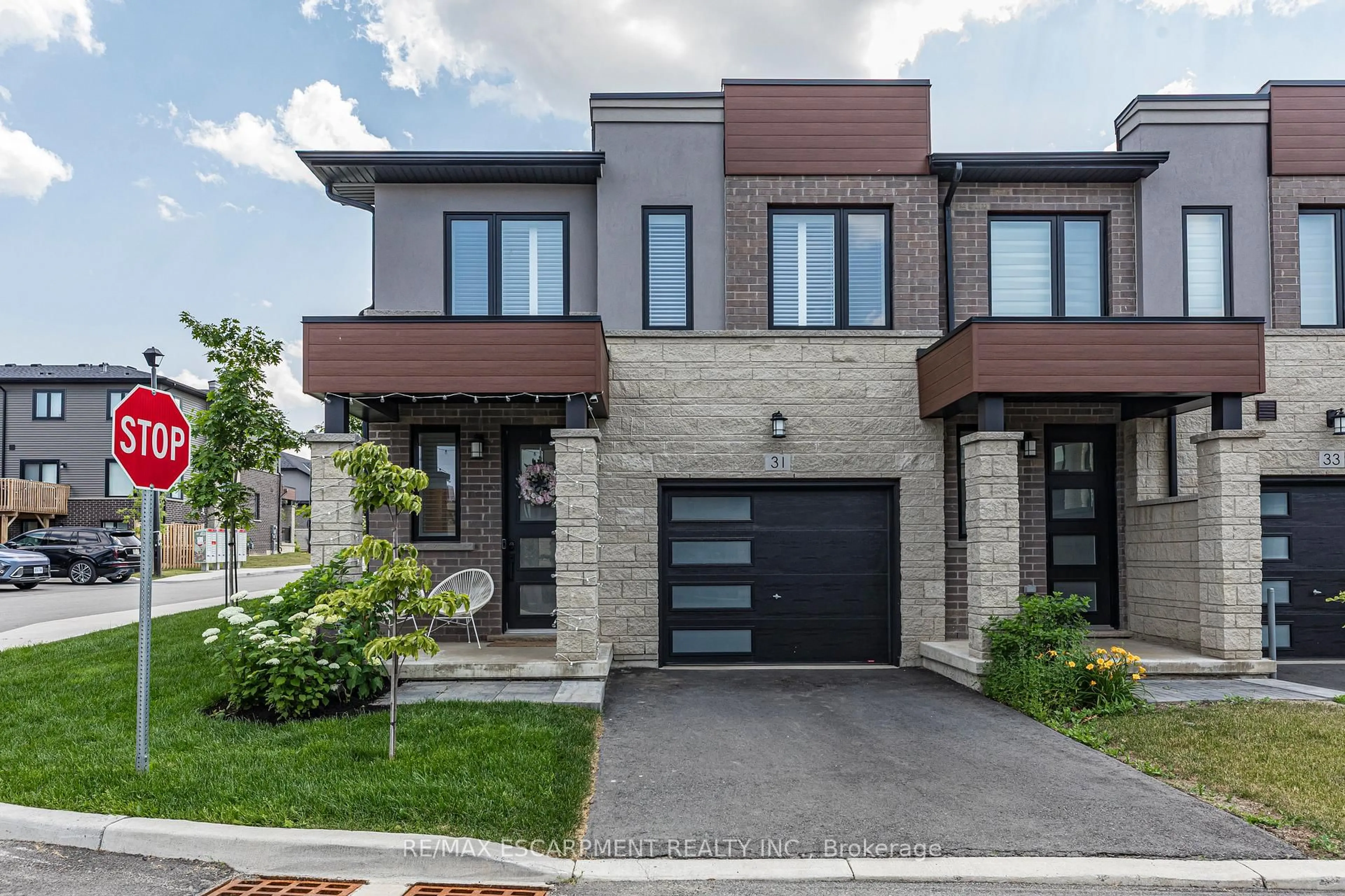 Home with brick exterior material, street for 31 Southam Lane, Hamilton Ontario L9C 0E9