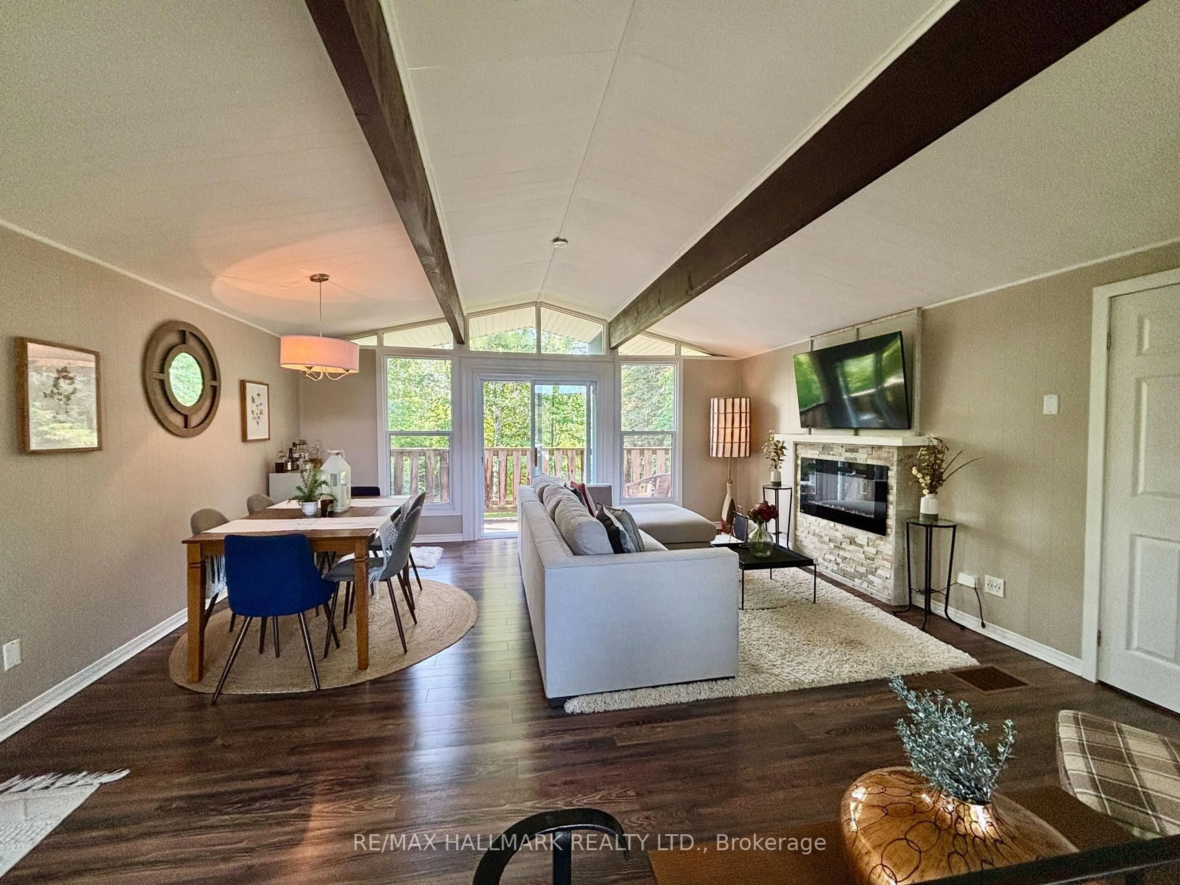 Living room with furniture, wood/laminate floor for 209892 Highway 26, Blue Mountains Ontario L9Y 0L1