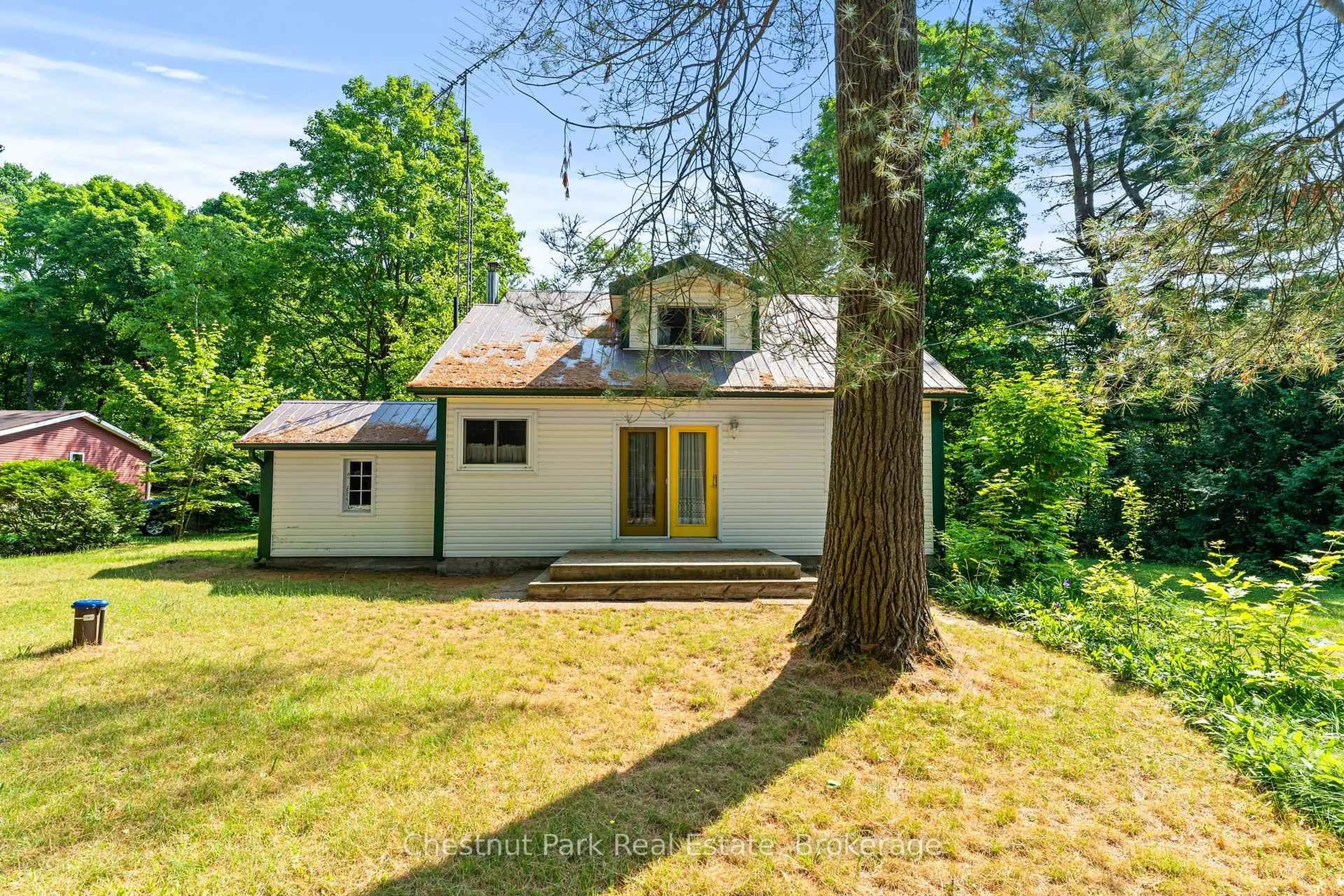 A pic from outside/outdoor area/front of a property/back of a property/a pic from drone, forest/trees view for 49 Beach Rd, Huntsville Ontario P0B 1M0