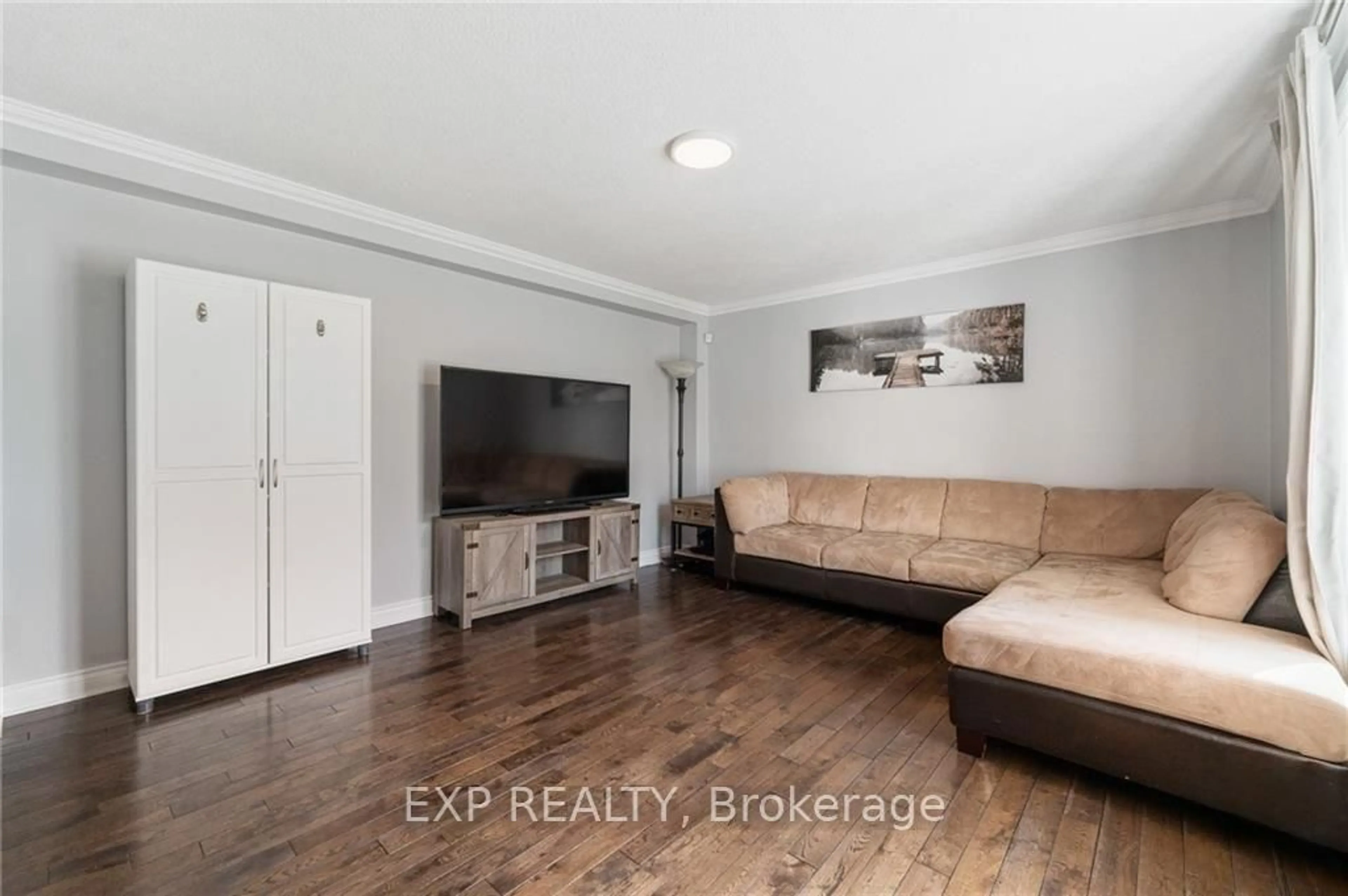 Living room with furniture, wood/laminate floor for 3561 TRIM Rd, Ottawa Ontario K4B 1N4