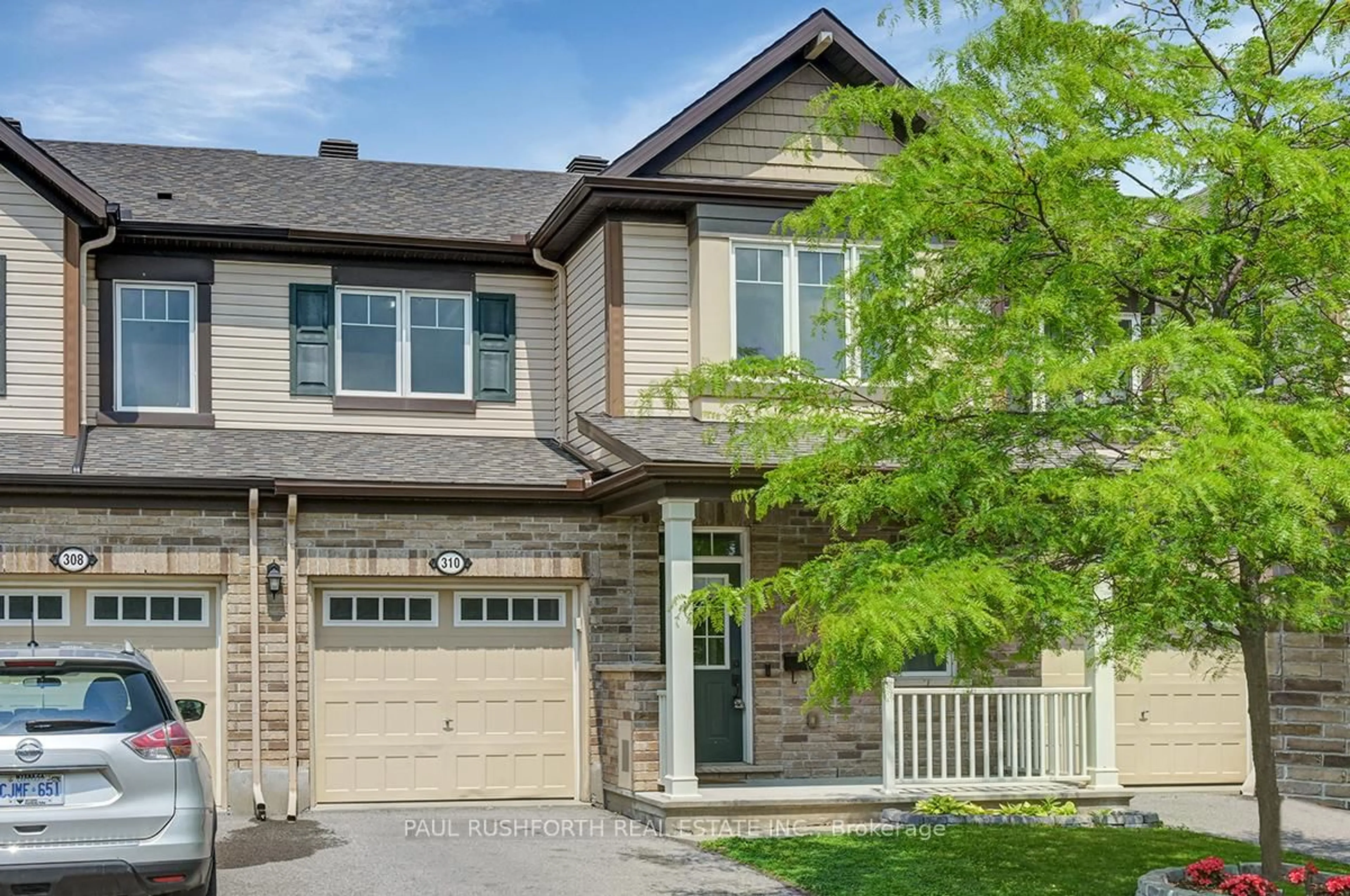 Home with brick exterior material, street for 310 Astelia Cres, Stittsville Ontario K7S 0W7
