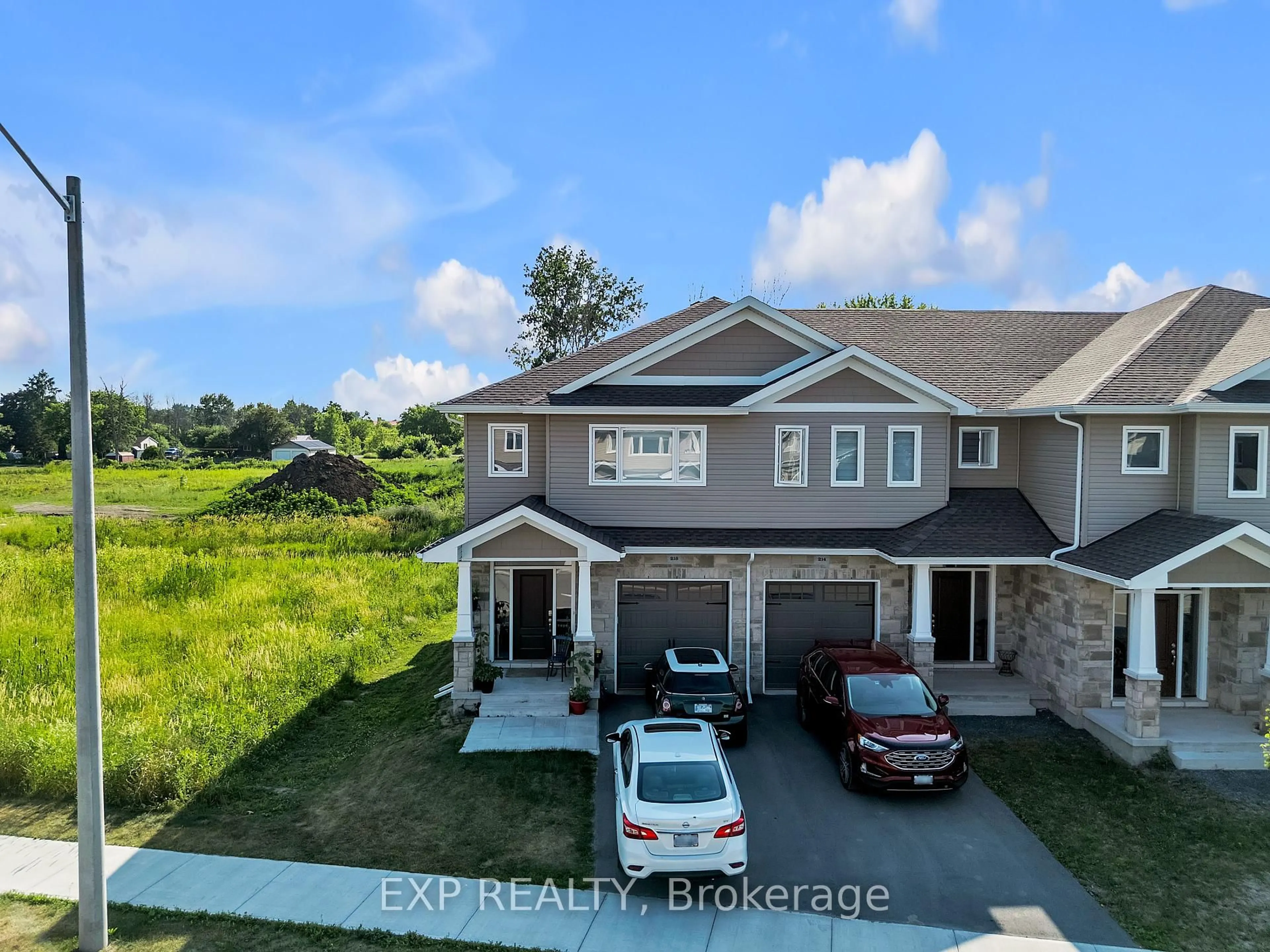 A pic from outside/outdoor area/front of a property/back of a property/a pic from drone, water/lake/river/ocean view for 216 Heritage Park Dr, Greater Napanee Ontario K7R 3X8