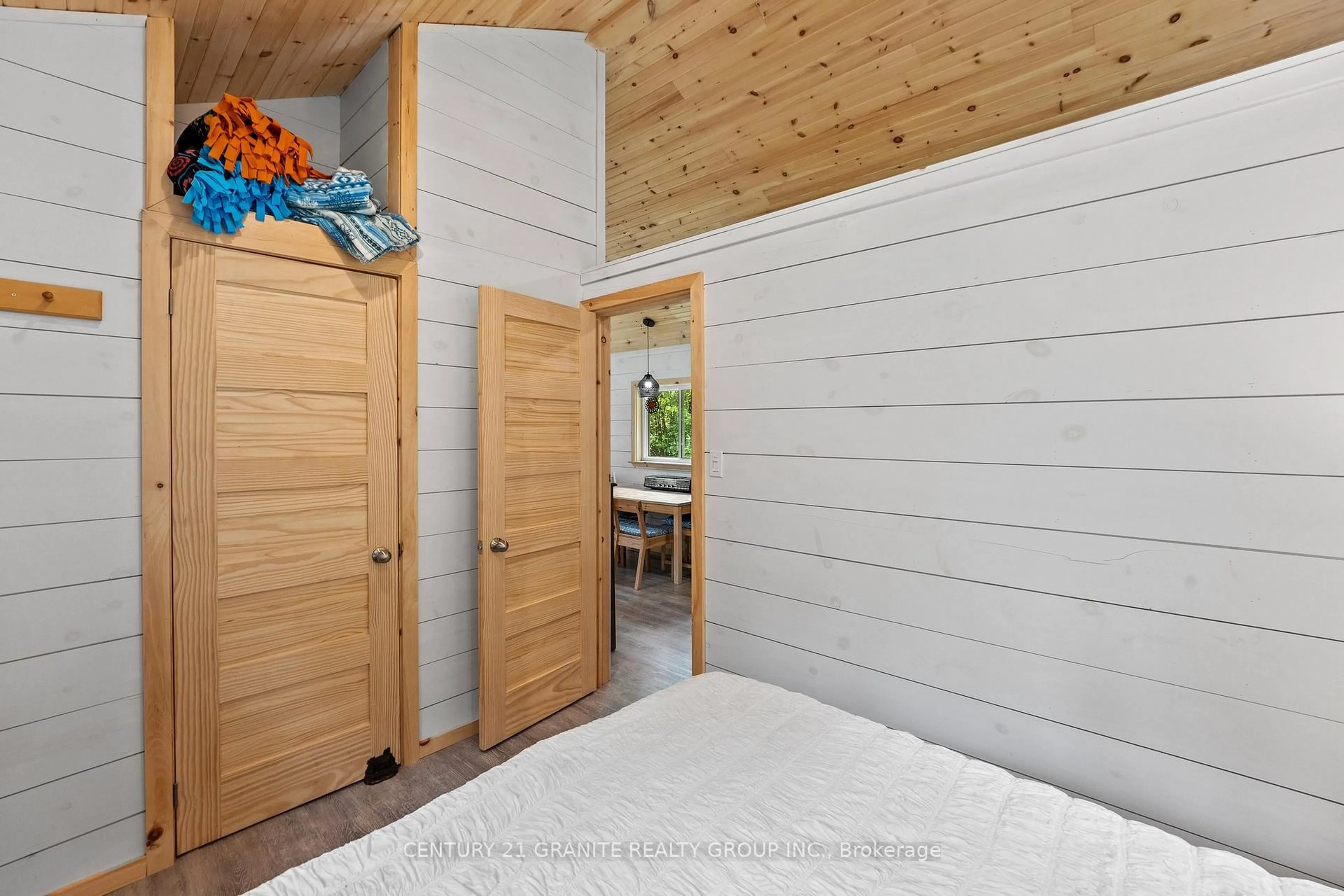 Bedroom with bed, wood/laminate floor for 1224 Hagen Rd, Highlands East Ontario K0L 2A0