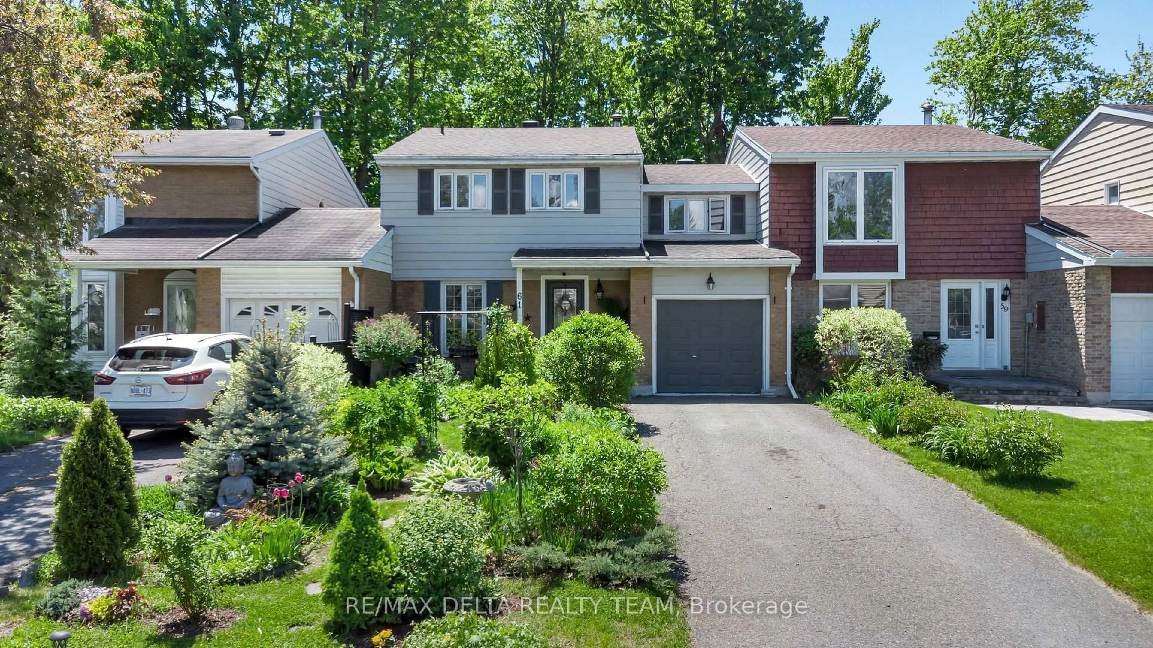 Home with brick exterior material, street for 61 Valewood Cres, Ottawa Ontario K1B 4G1