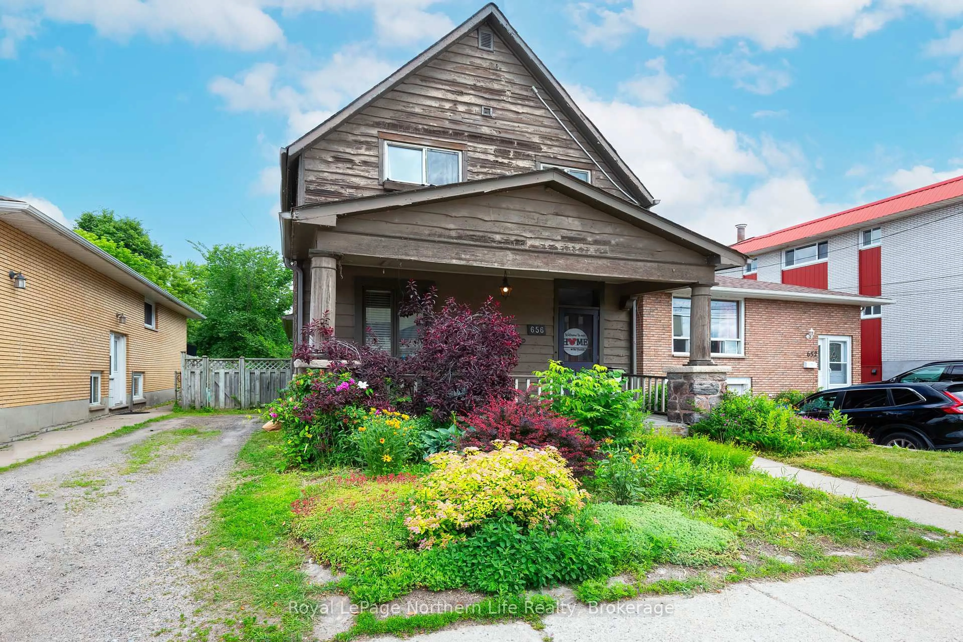 Home with brick exterior material, street for 656 Main St, North Bay Ontario P1B 2V5