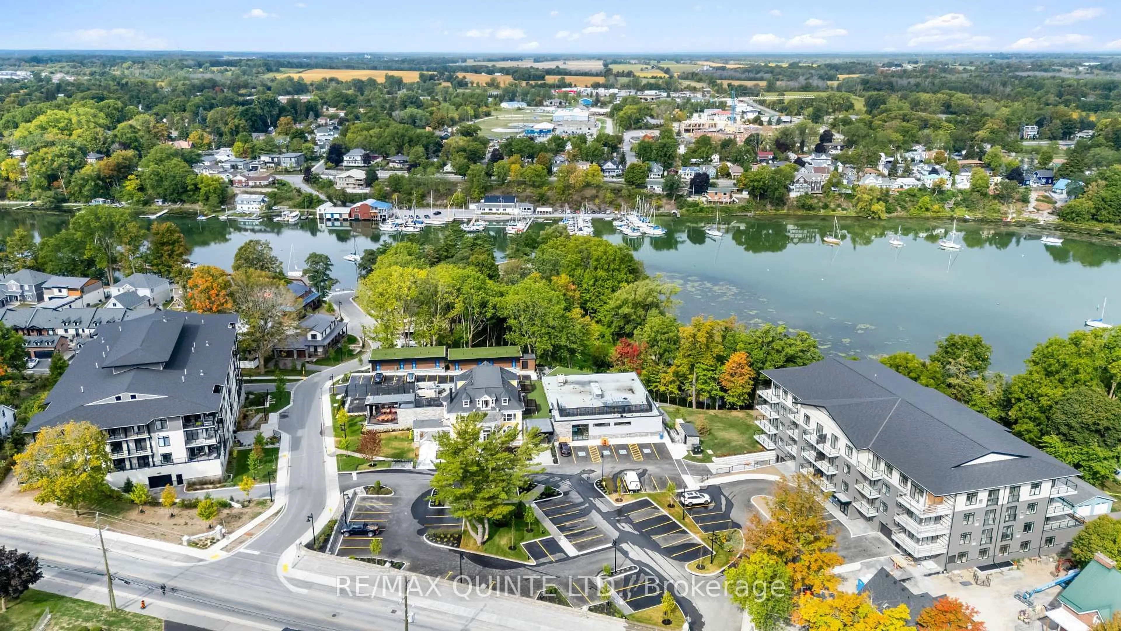 A pic from outside/outdoor area/front of a property/back of a property/a pic from drone, water/lake/river/ocean view for 17 Cleave Ave #405, Prince Edward County Ontario K0K 2T0