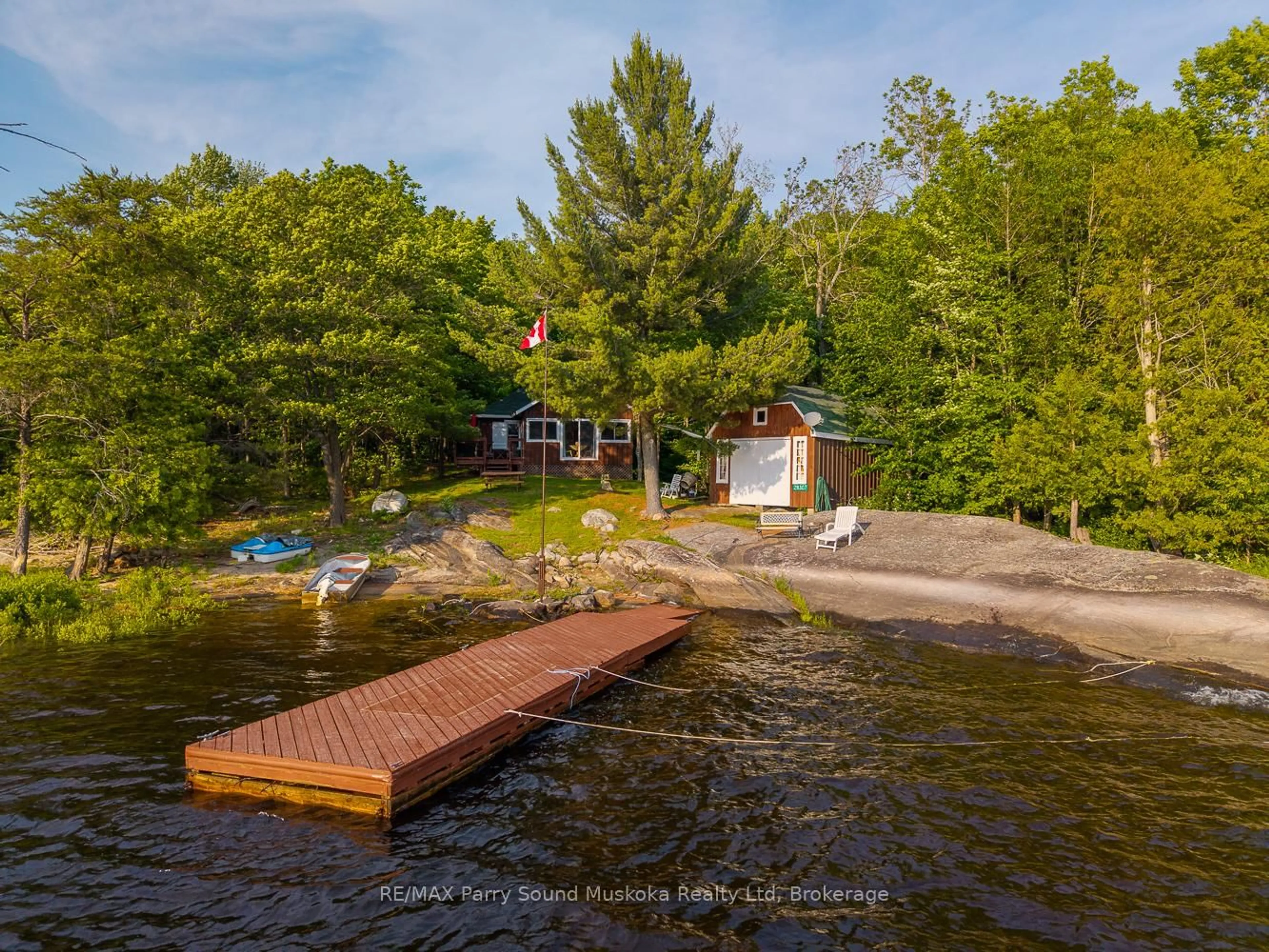 A pic from outside/outdoor area/front of a property/back of a property/a pic from drone, water/lake/river/ocean view for 28307 Wahwashkesh Lake, Whitestone Ontario P0A 1G0