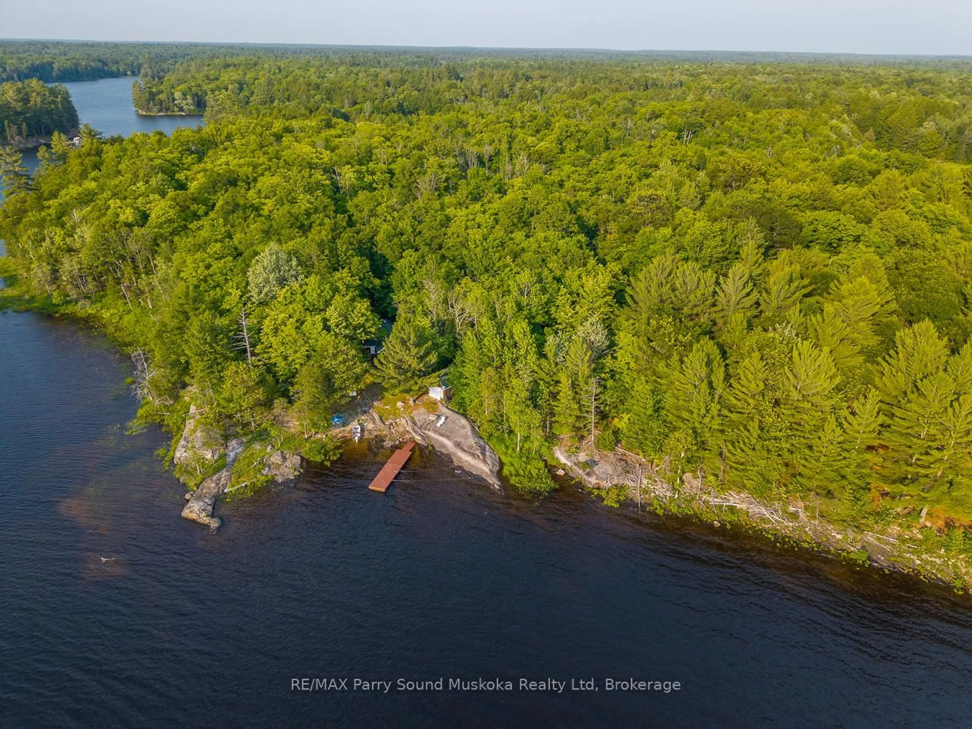 A pic from outside/outdoor area/front of a property/back of a property/a pic from drone, water/lake/river/ocean view for 28307 Wahwashkesh Lake, Whitestone Ontario P0A 1G0