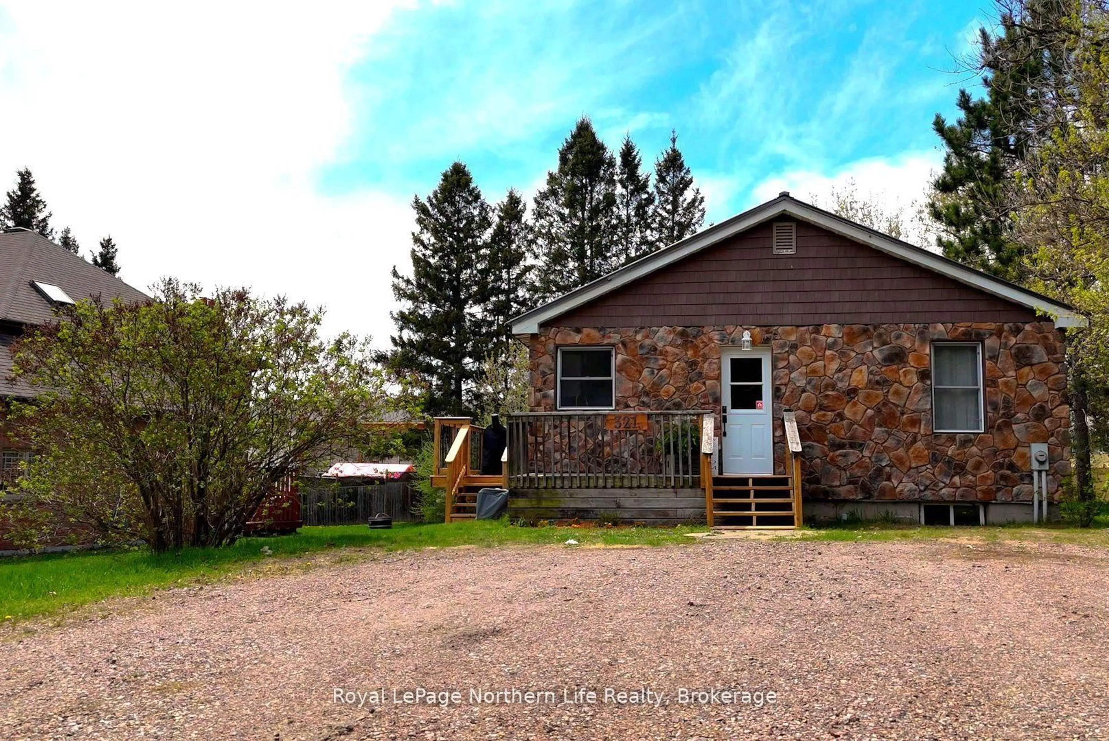 A pic from outside/outdoor area/front of a property/back of a property/a pic from drone, unknown for 321 Main St, Powassan Ontario P0H 1Z0