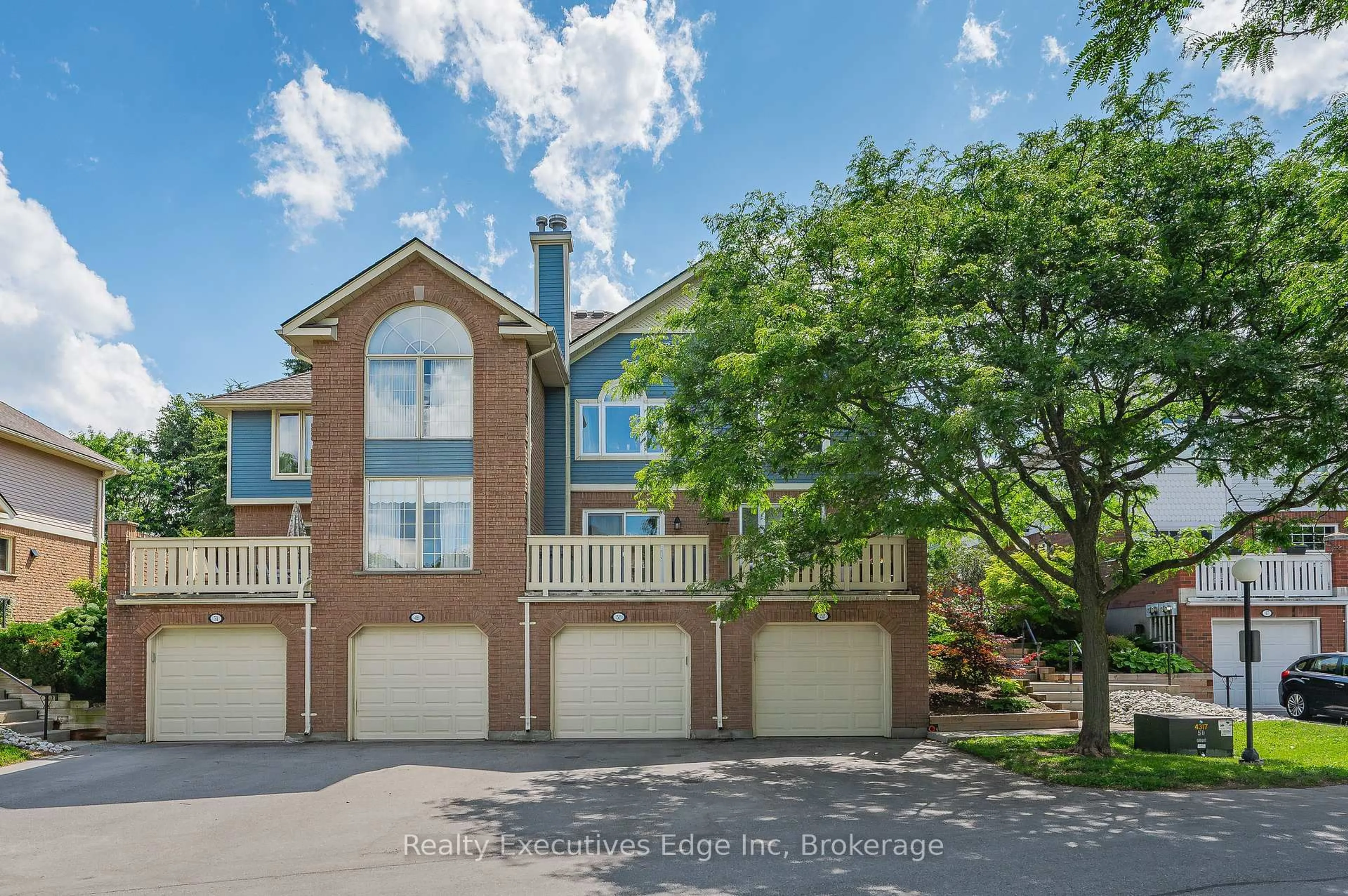 A pic from outside/outdoor area/front of a property/back of a property/a pic from drone, water/lake/river/ocean view for 941 Gordon St #50, Guelph Ontario N1G 4R9