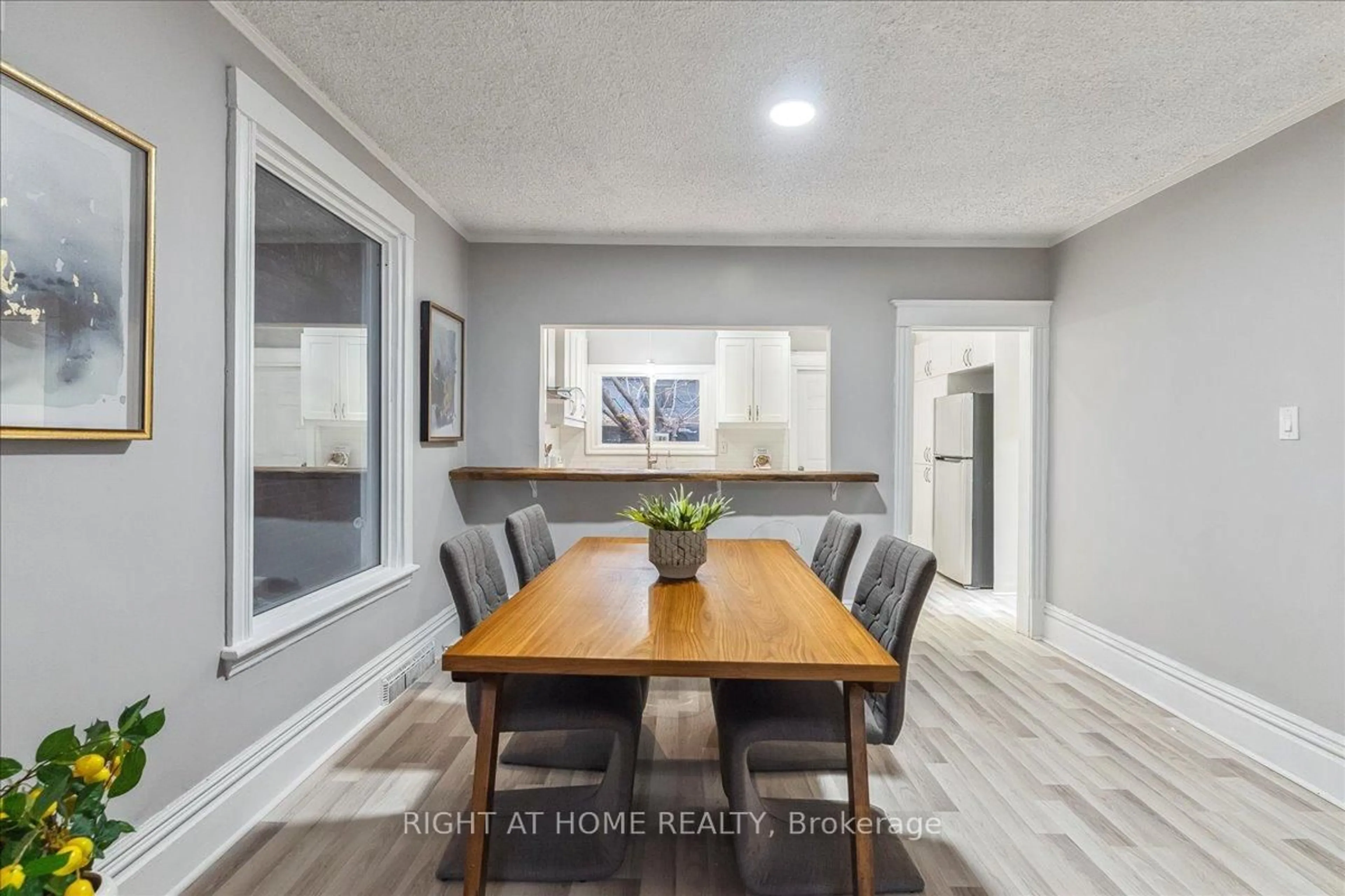 Dining room, wood/laminate floor for 16 Birch Ave, Hamilton Ontario L8L 6H3