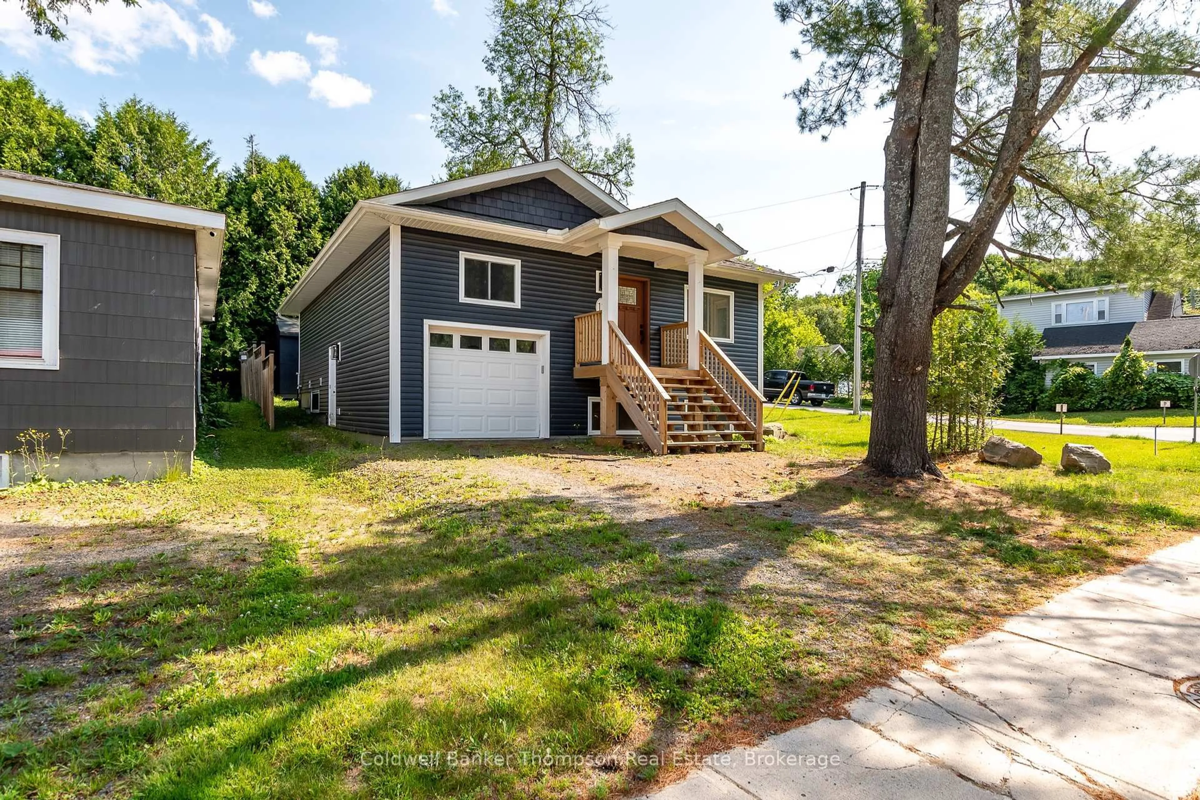 Home with vinyl exterior material, street for 13 Florence St, Huntsville Ontario P1H 1T2
