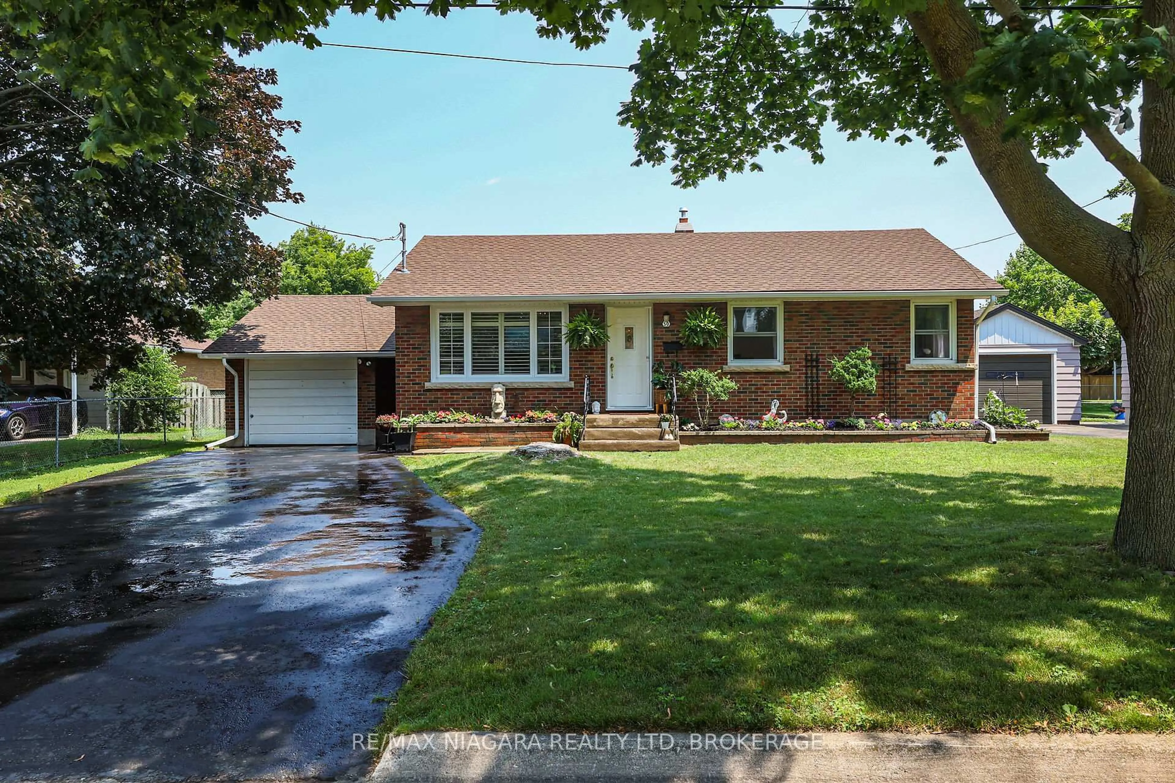 Home with brick exterior material, street for 50 Woodelm Dr, St. Catharines Ontario L2M 4N3