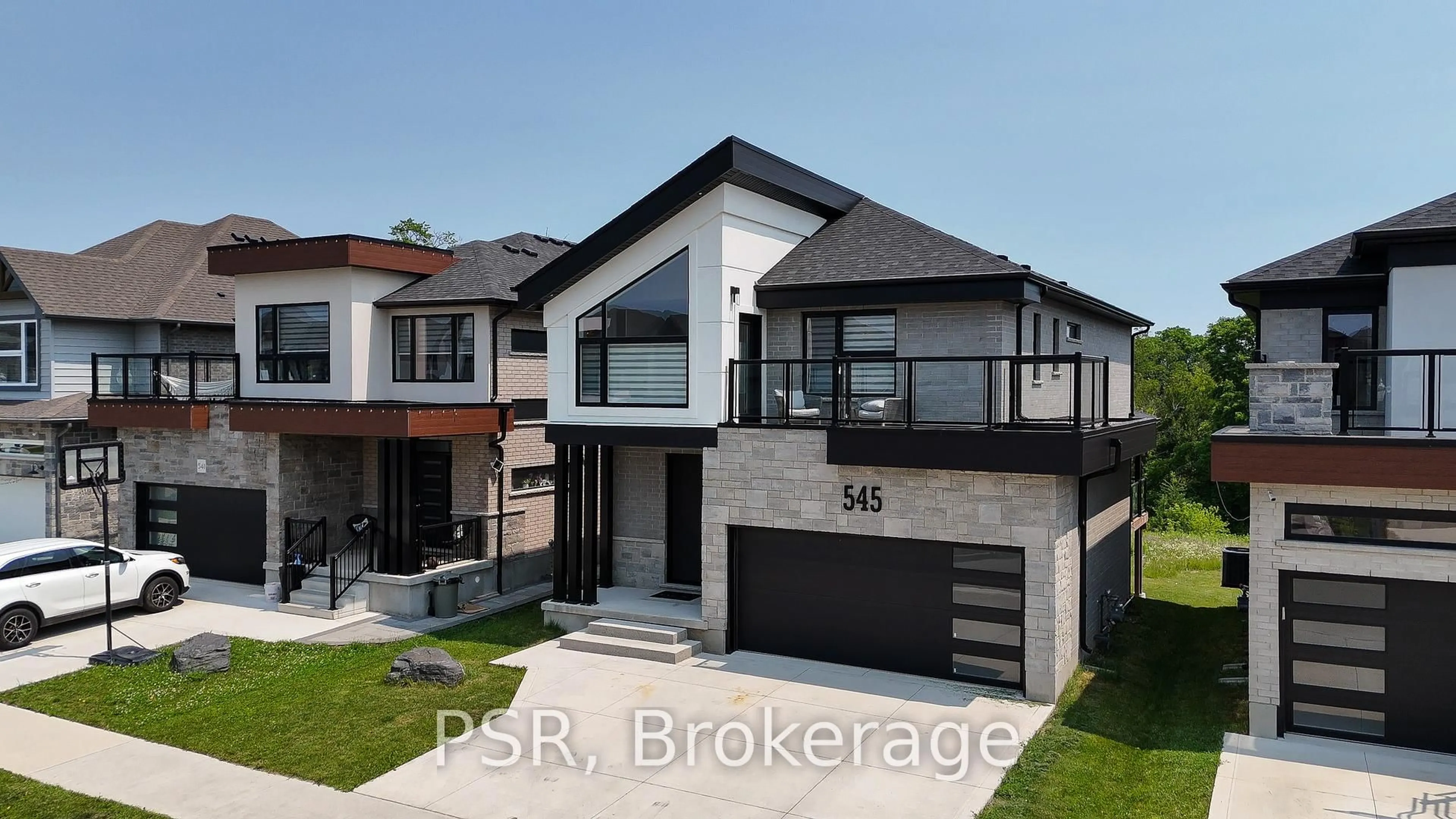 Home with brick exterior material, street for 545 Doonwoods Cres, Kitchener Ontario N2P 0E5