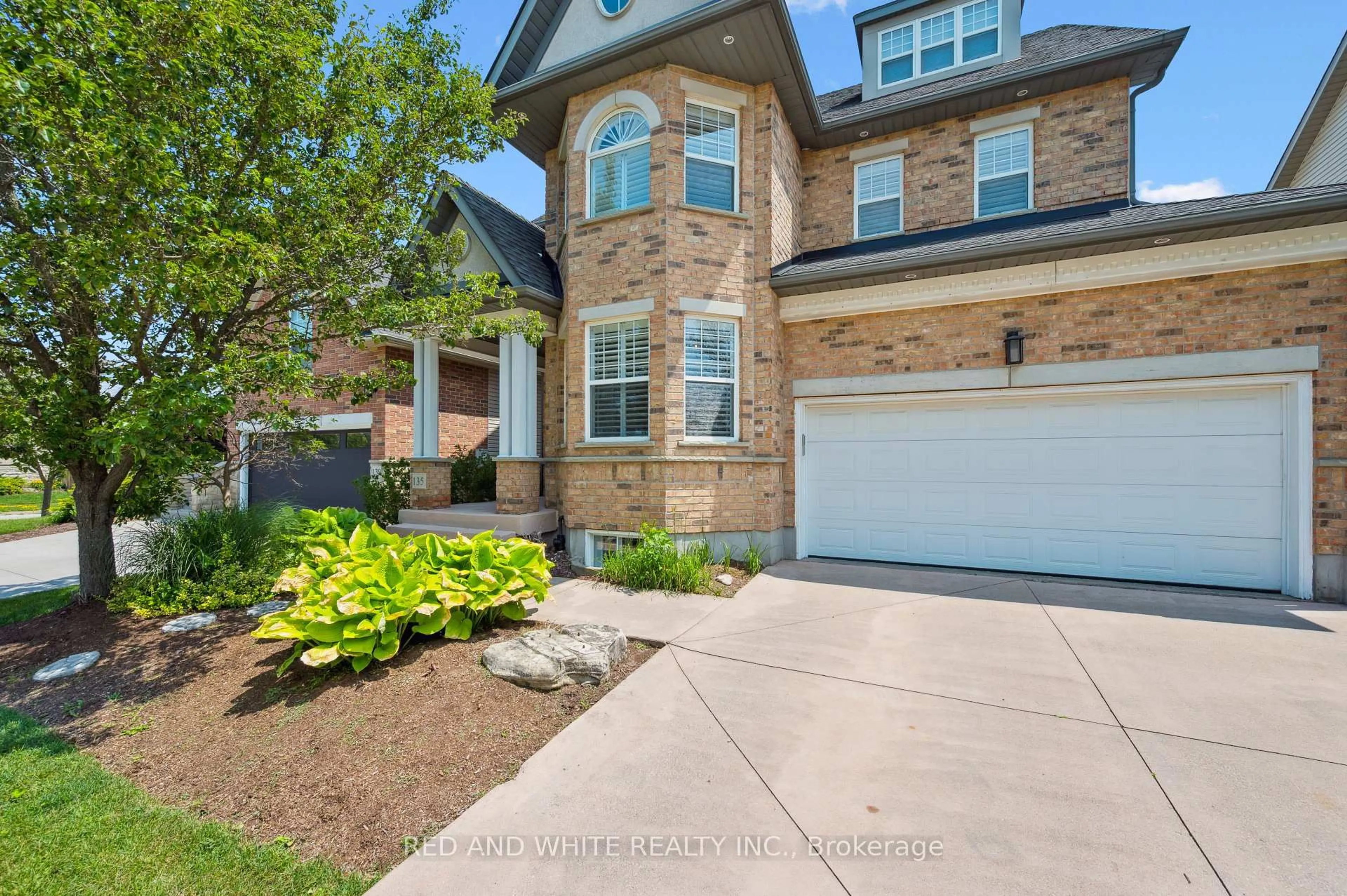 Home with brick exterior material, street for 135 Hawkswood Dr, Kitchener Ontario N2K 4J4
