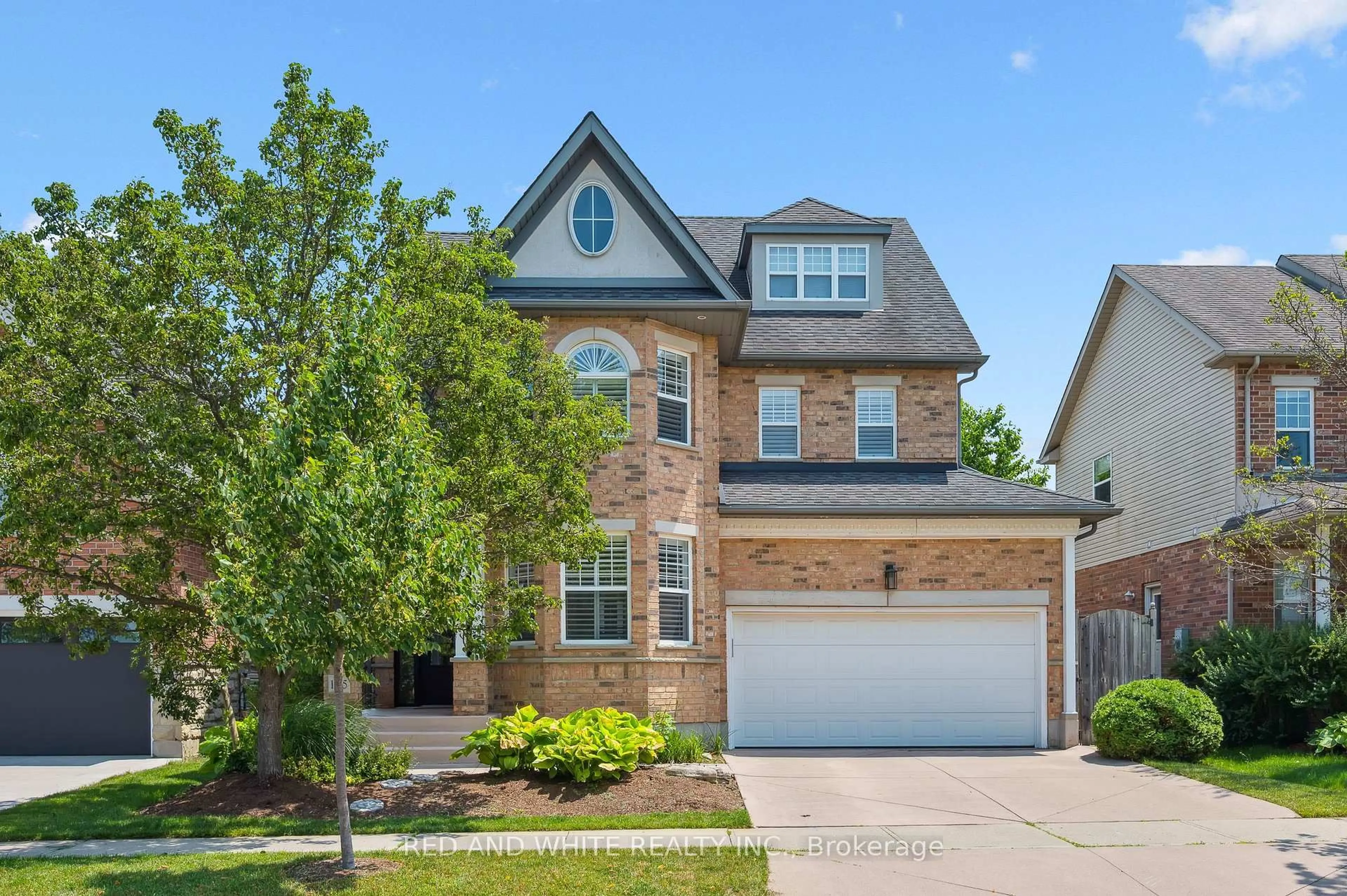 Home with brick exterior material, street for 135 Hawkswood Dr, Kitchener Ontario N2K 4J4