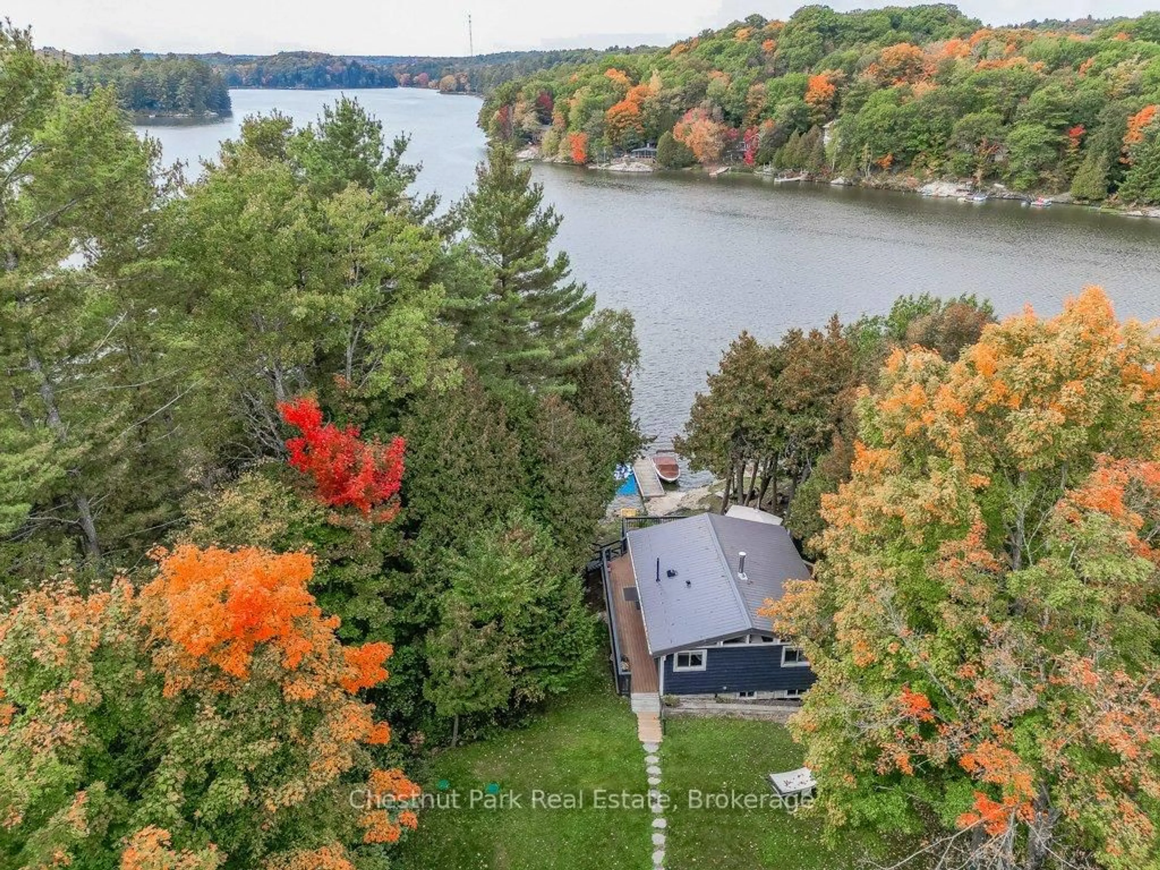 A pic from outside/outdoor area/front of a property/back of a property/a pic from drone, water/lake/river/ocean view for 1140 Cowan Park Rd #8, Muskoka Lakes Ontario P0B 1M0