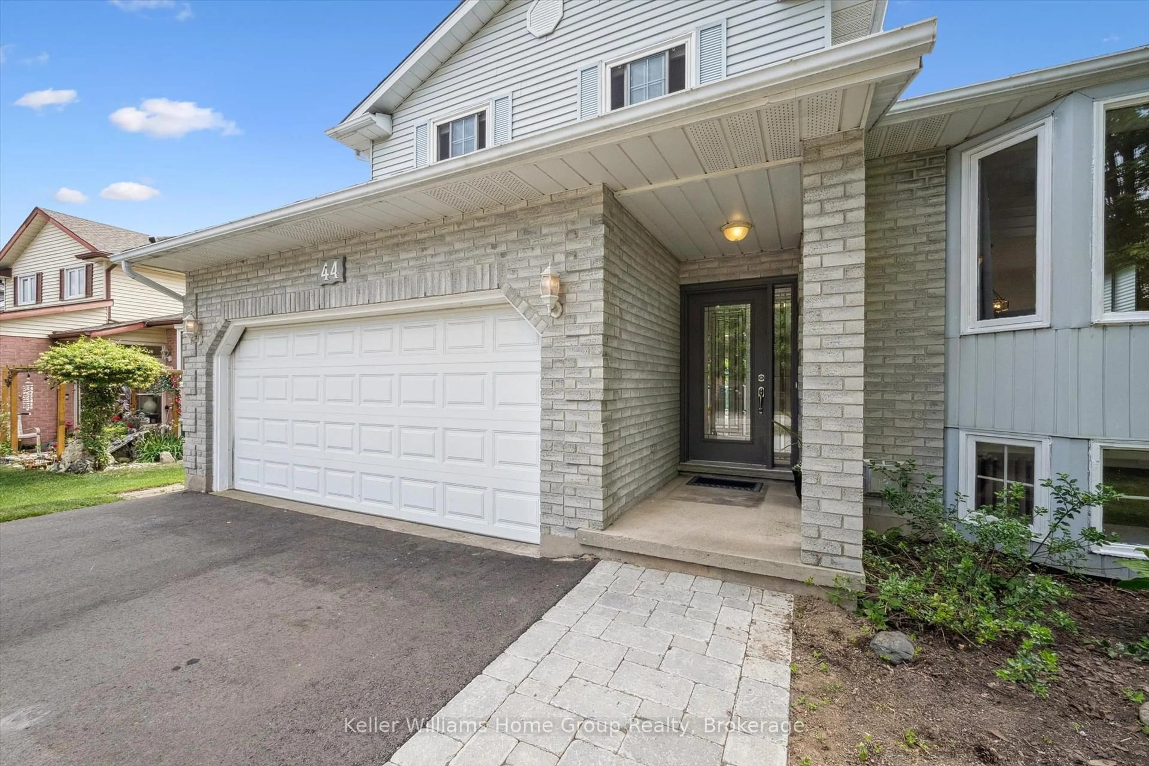 Home with brick exterior material, street for 44 Greenwich Dr, Guelph Ontario N1H 8C6