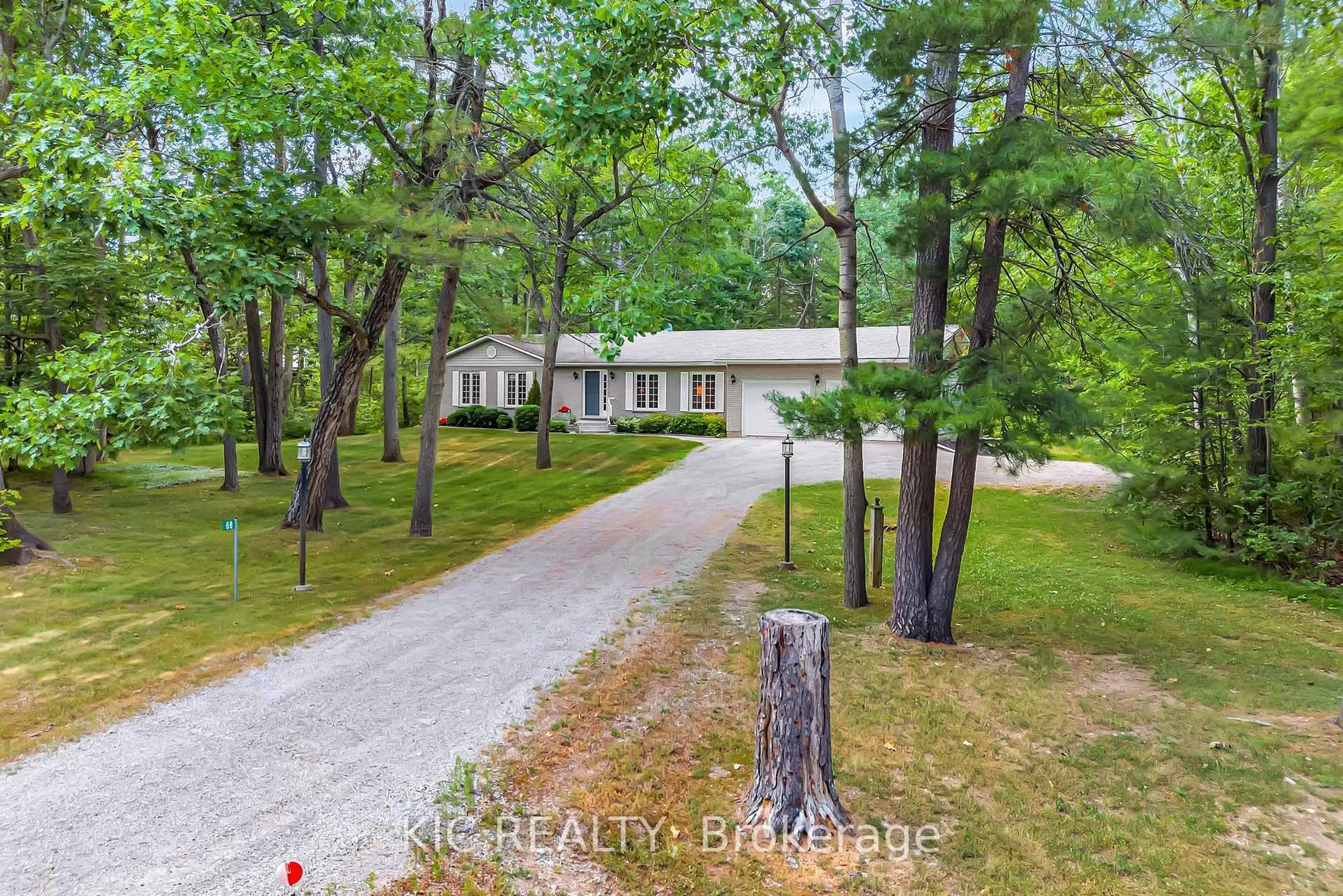 A pic from outside/outdoor area/front of a property/back of a property/a pic from drone, forest/trees view for 68 Sandy Point Rd, Kawartha Lakes Ontario K0M 1N0