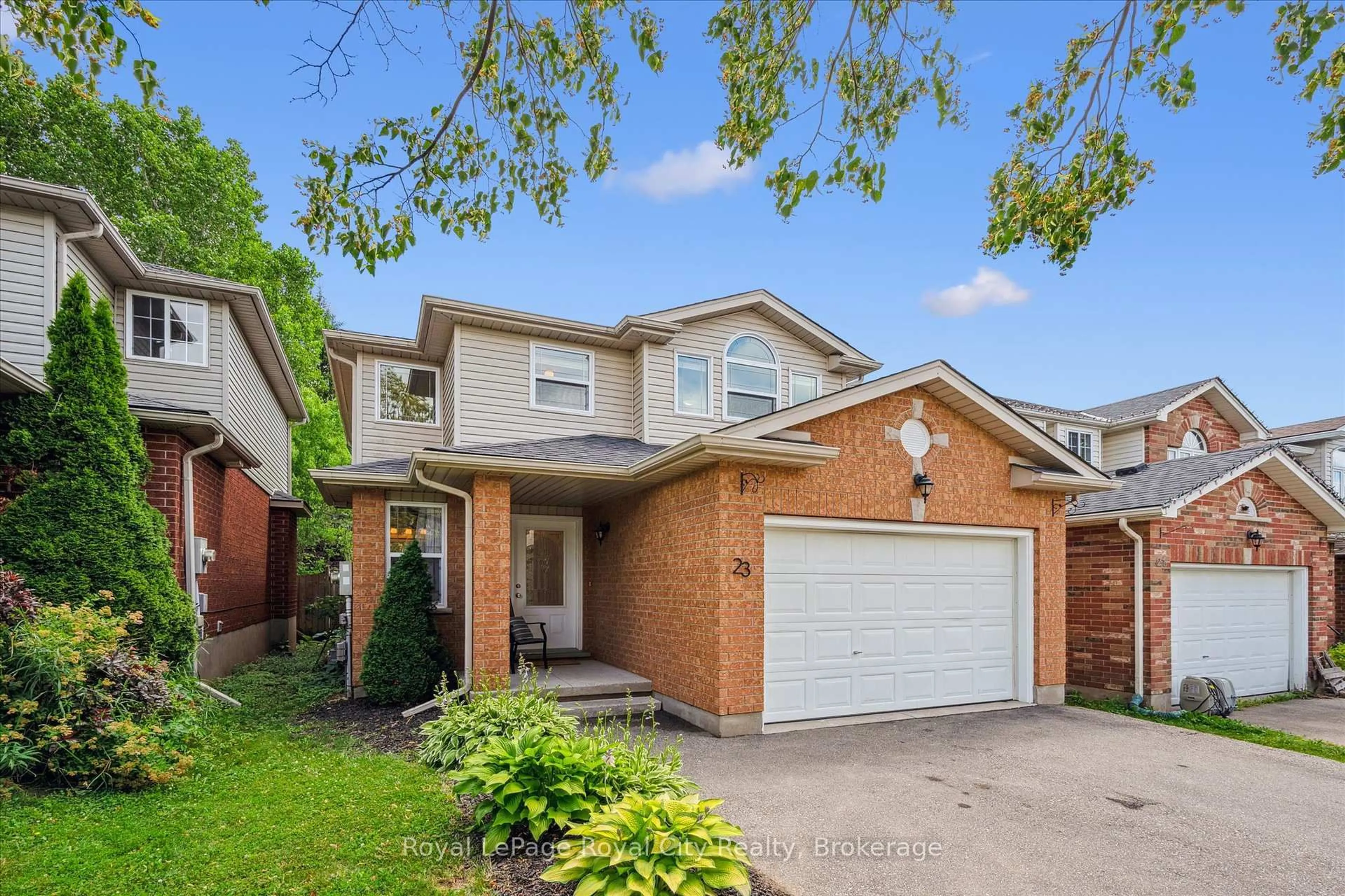 Home with brick exterior material, street for 23 Fuller Dr, Guelph Ontario N1E 7J4