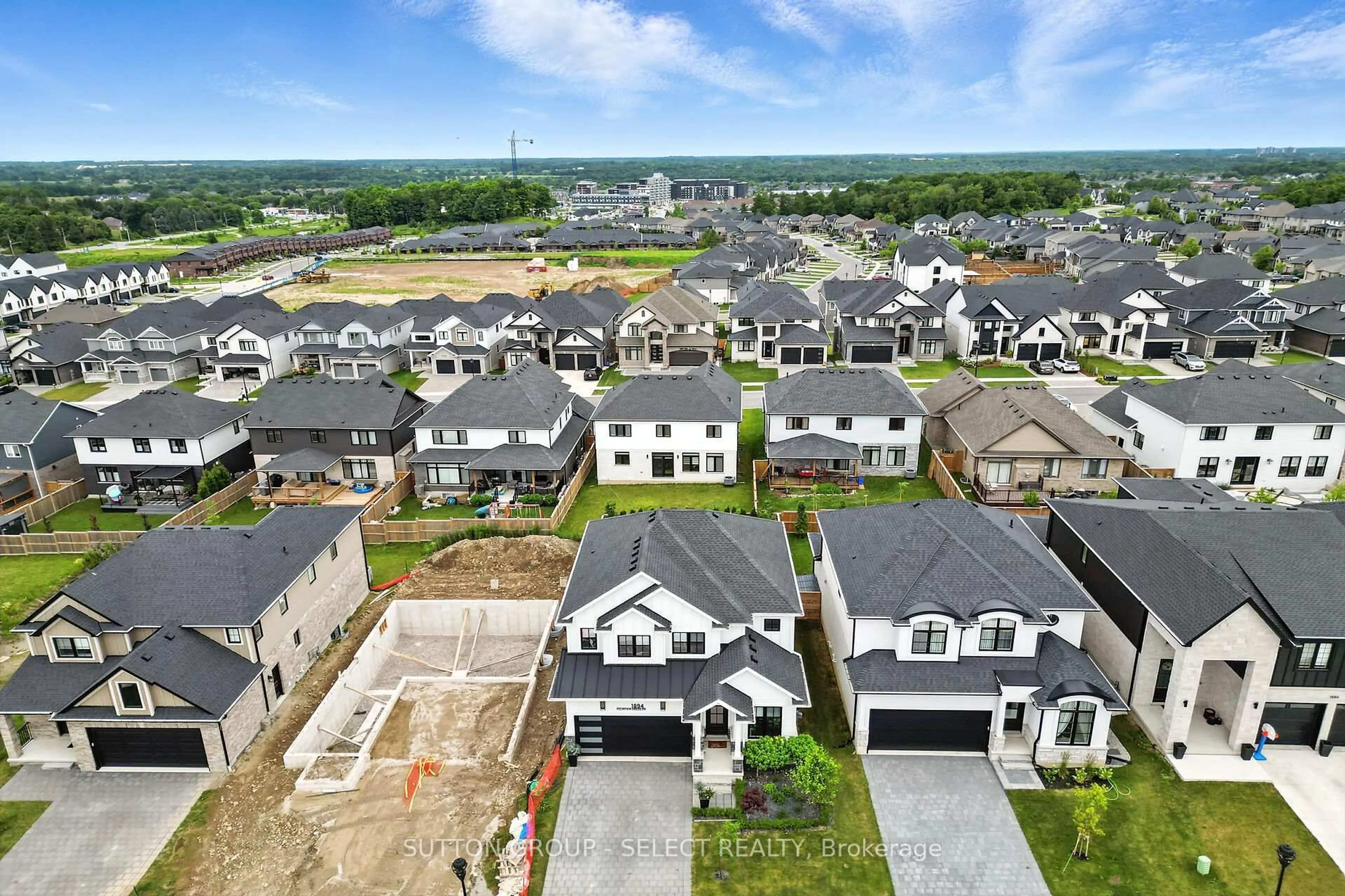 A pic from outside/outdoor area/front of a property/back of a property/a pic from drone, unknown for 1894 Fountain Grass Dr, London South Ontario N6K 4P9