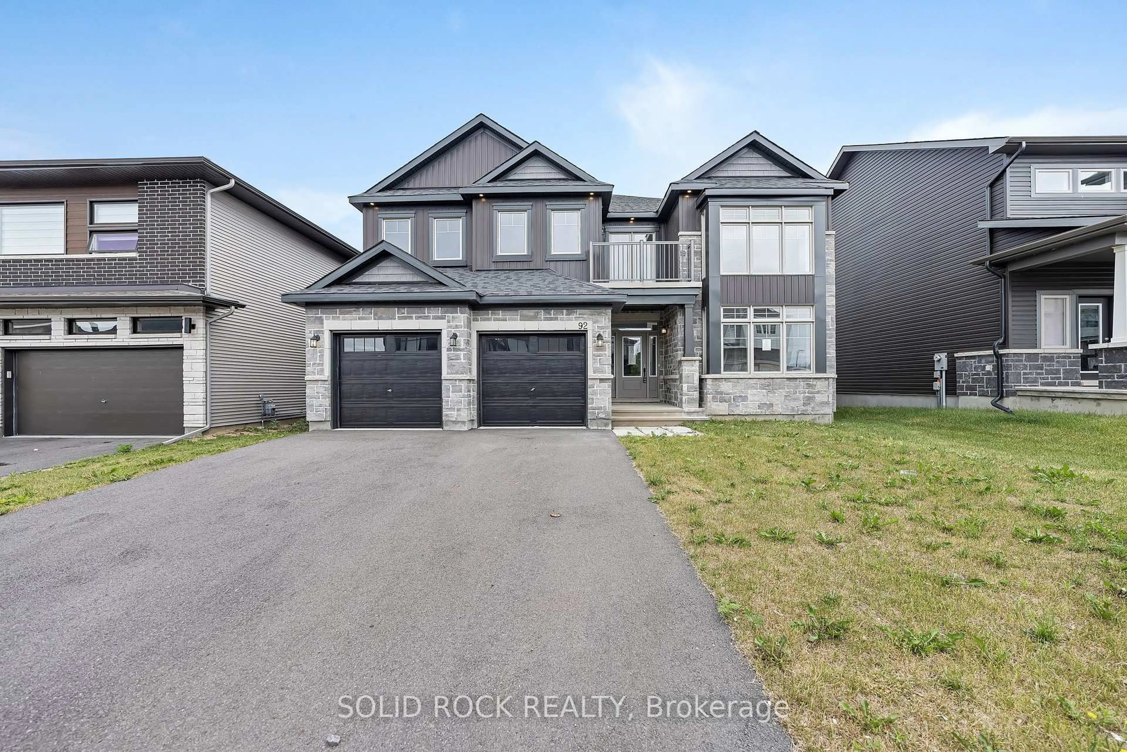 Home with brick exterior material, street for 92 Esban Dr, Ottawa Ontario K1X 0J3