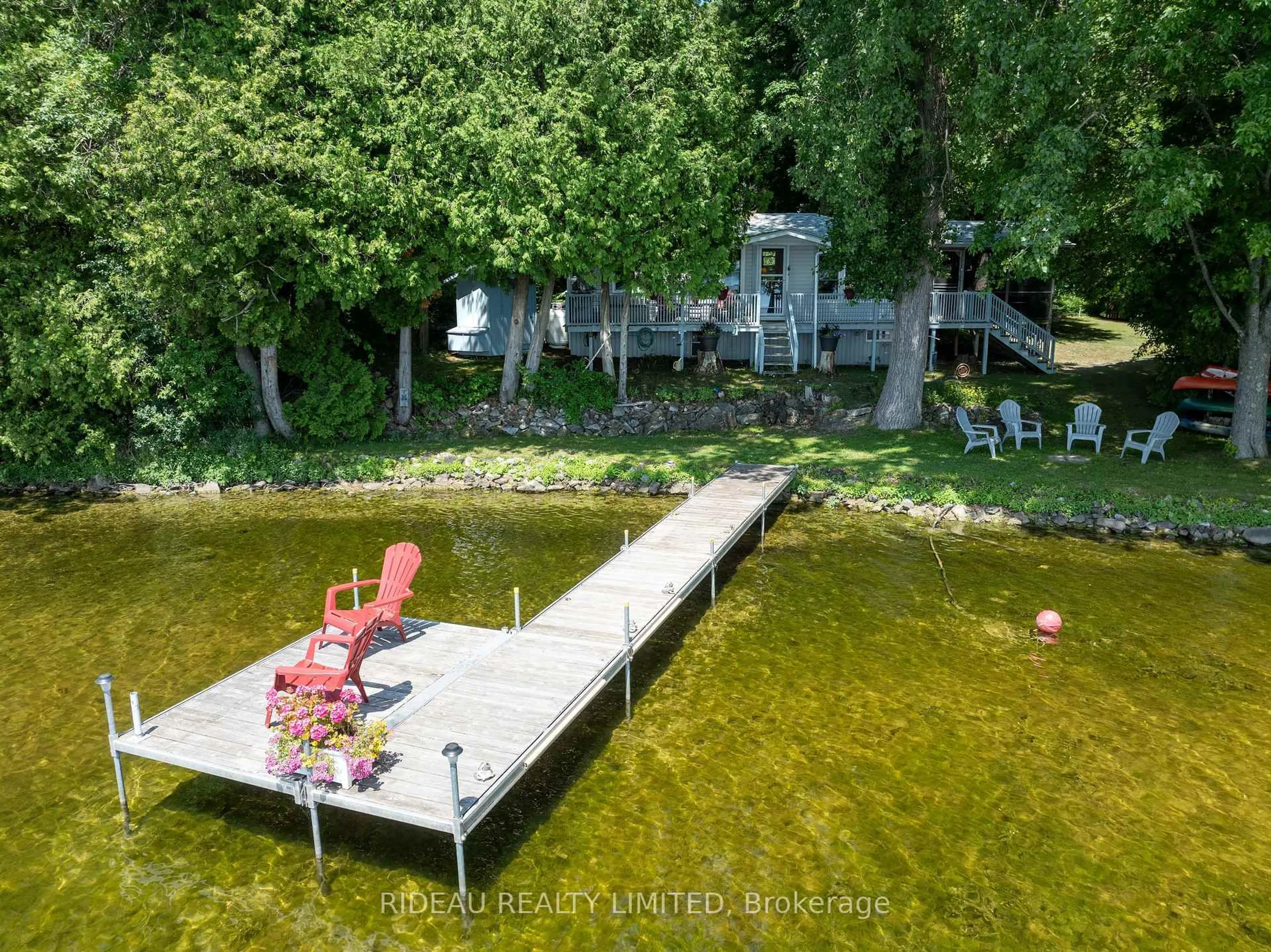 A pic from outside/outdoor area/front of a property/back of a property/a pic from drone, water/lake/river/ocean view for 16 Railroad St, Rideau Lakes Ontario K0E 1G0