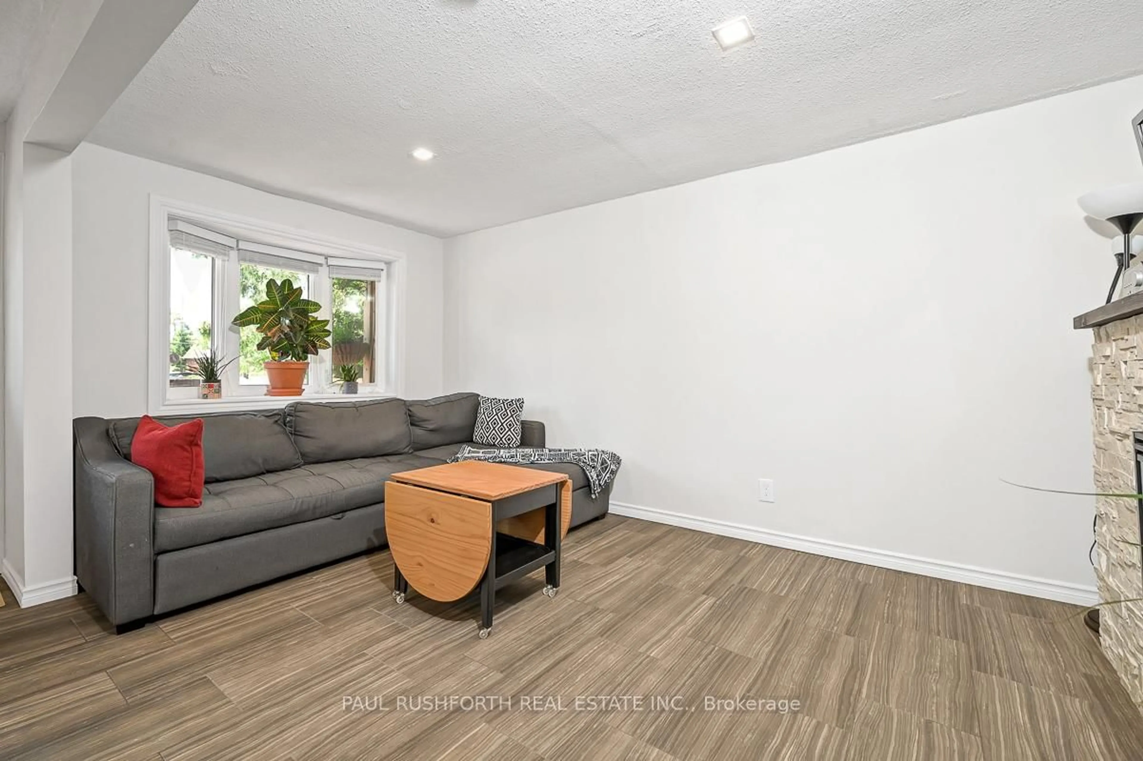 Living room with furniture, wood/laminate floor for 103 Ottawa St, The Nation Ontario K0A 2M0