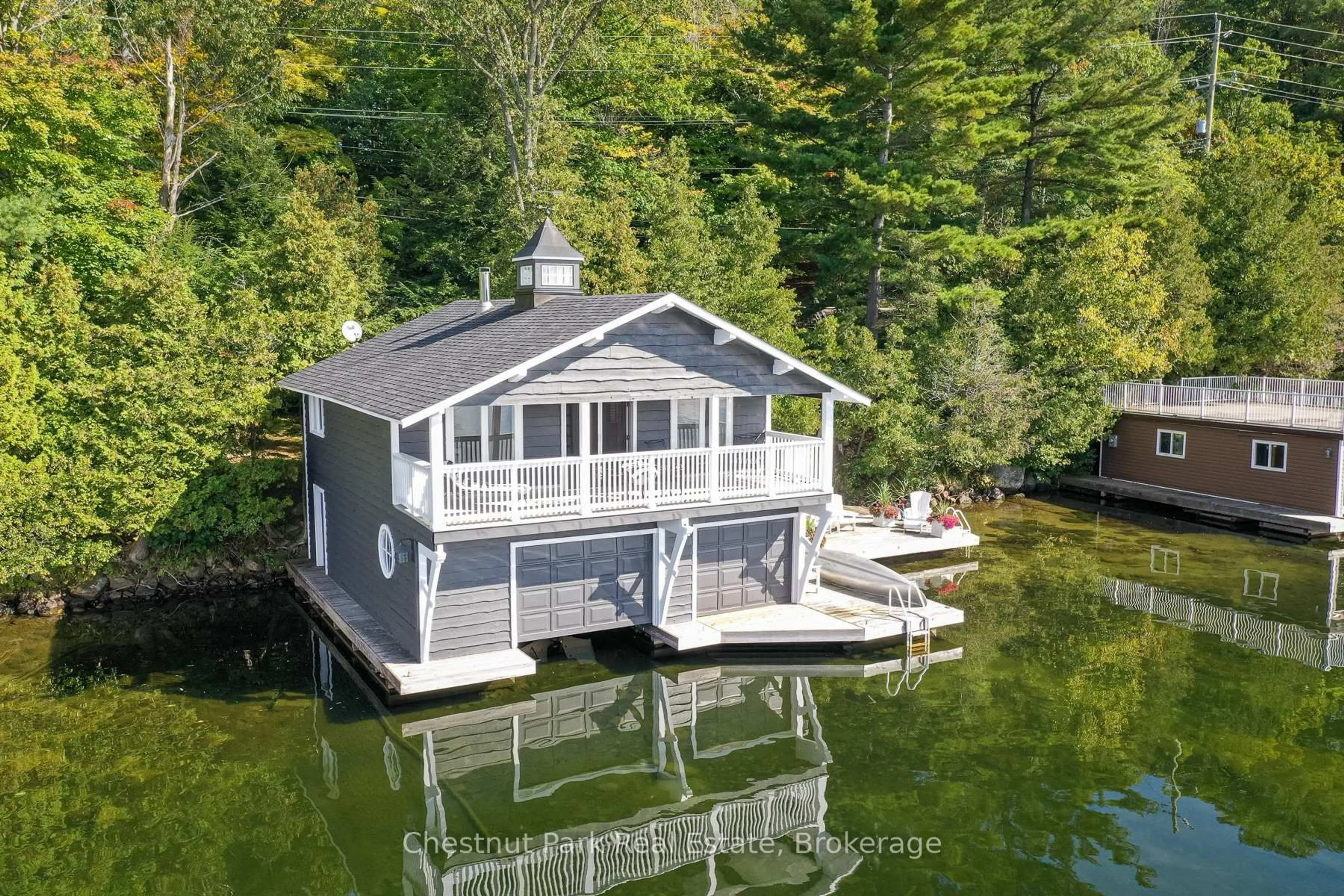 A pic from outside/outdoor area/front of a property/back of a property/a pic from drone, water/lake/river/ocean view for 1375 Peninsula Rd, Muskoka Lakes Ontario P0B 1J0